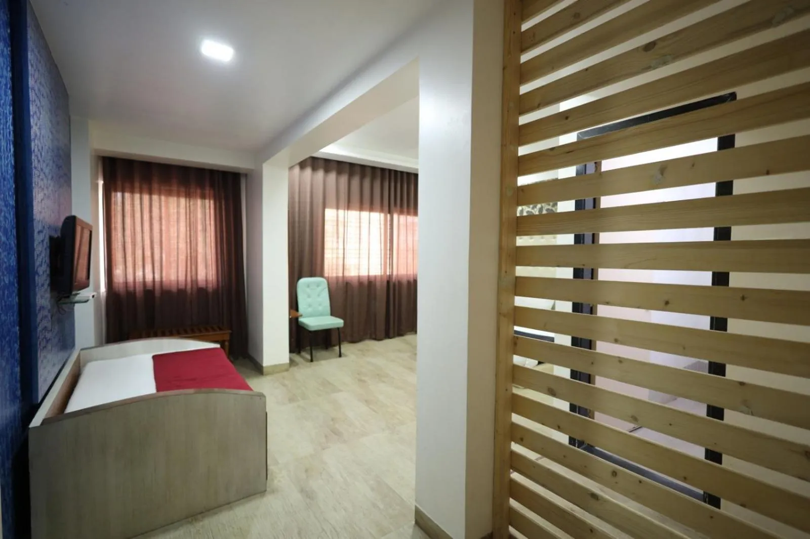 Living room, Bed in Saish Hotel Shirdi