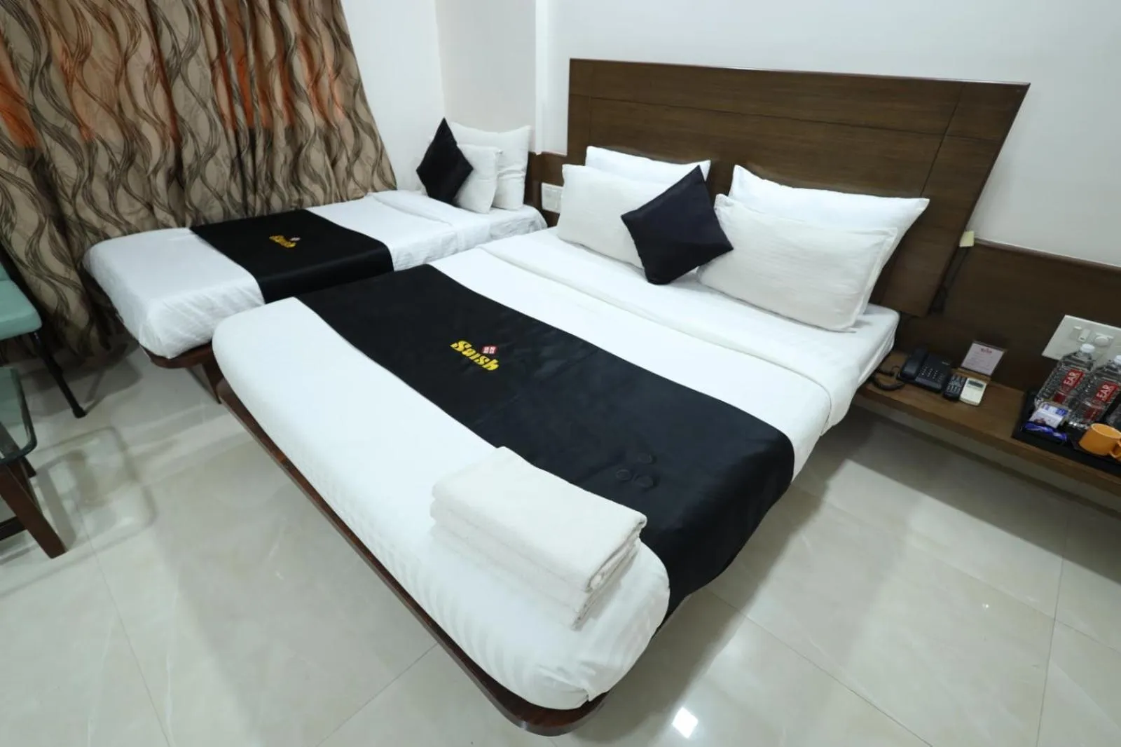 Bed in Saish Hotel Shirdi