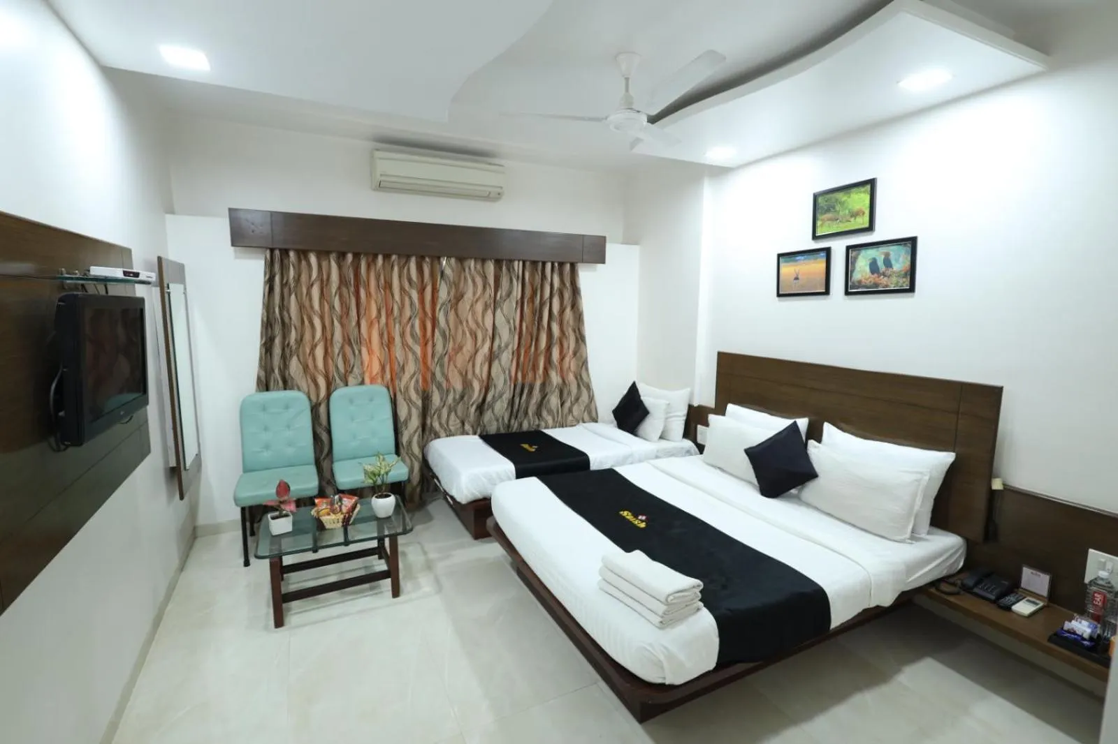Photo of the whole room, Bed in Saish Hotel Shirdi