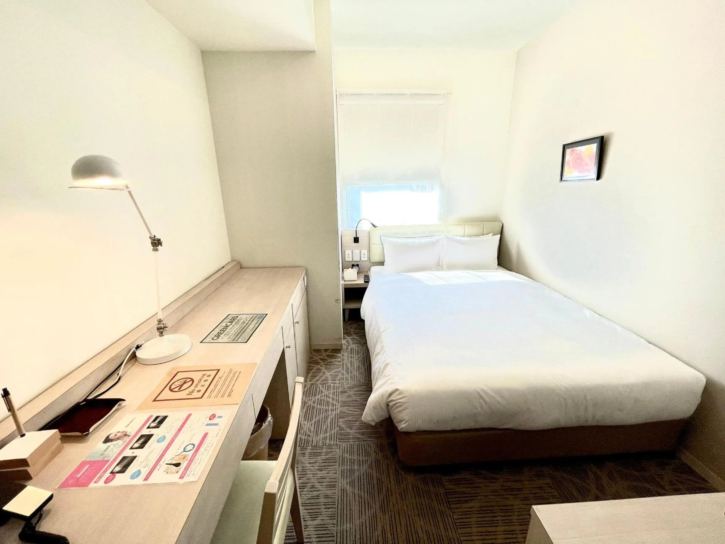 Bed in QuintessaHotel TokyoHaneda Comic&Books