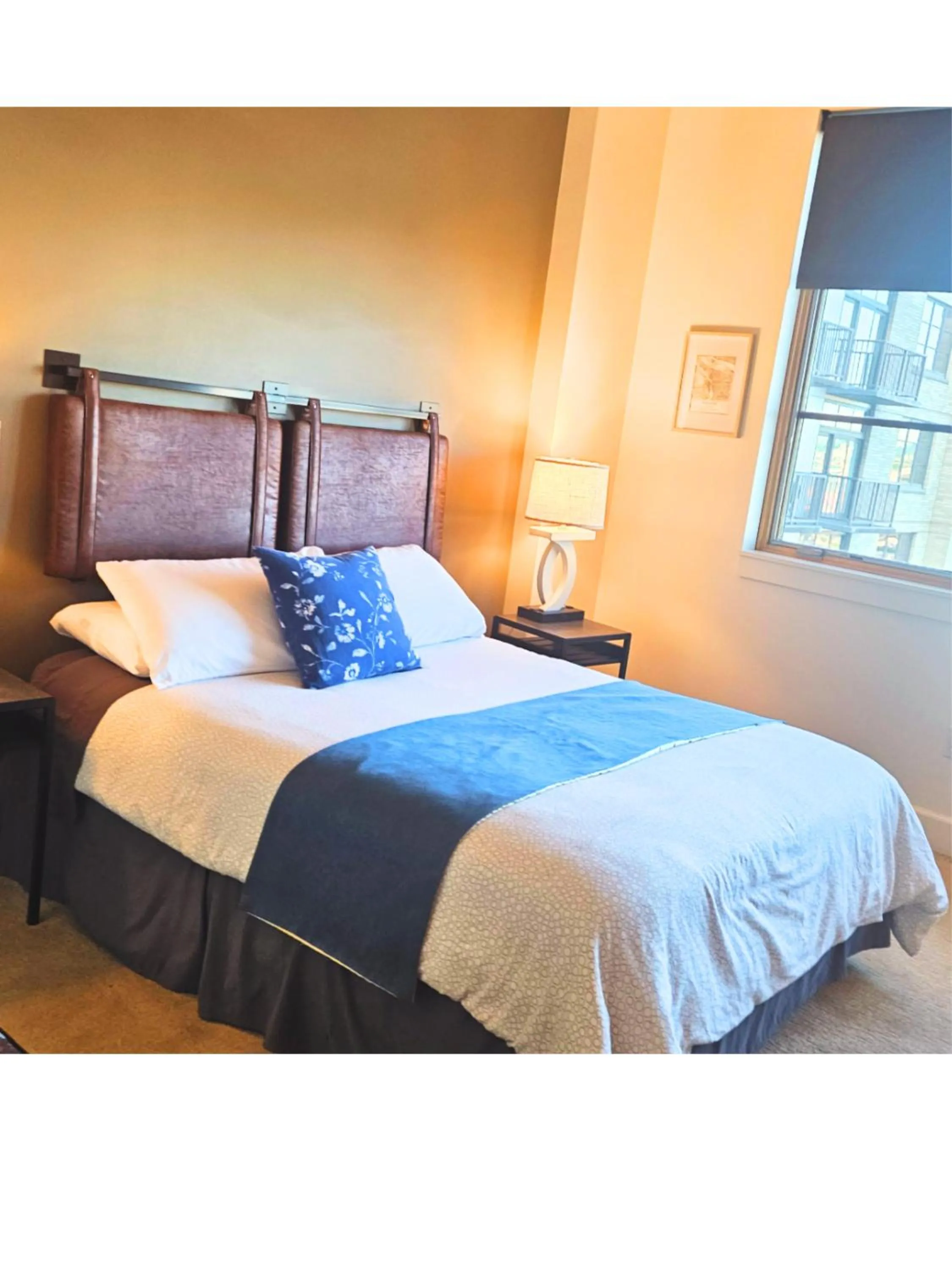 Bed in Renu Suites at The Burlington Portland