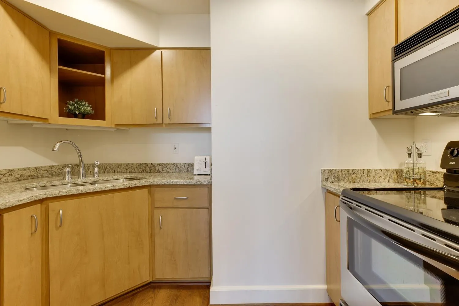 Kitchen or kitchenette in Renu Suites at The Burlington Portland