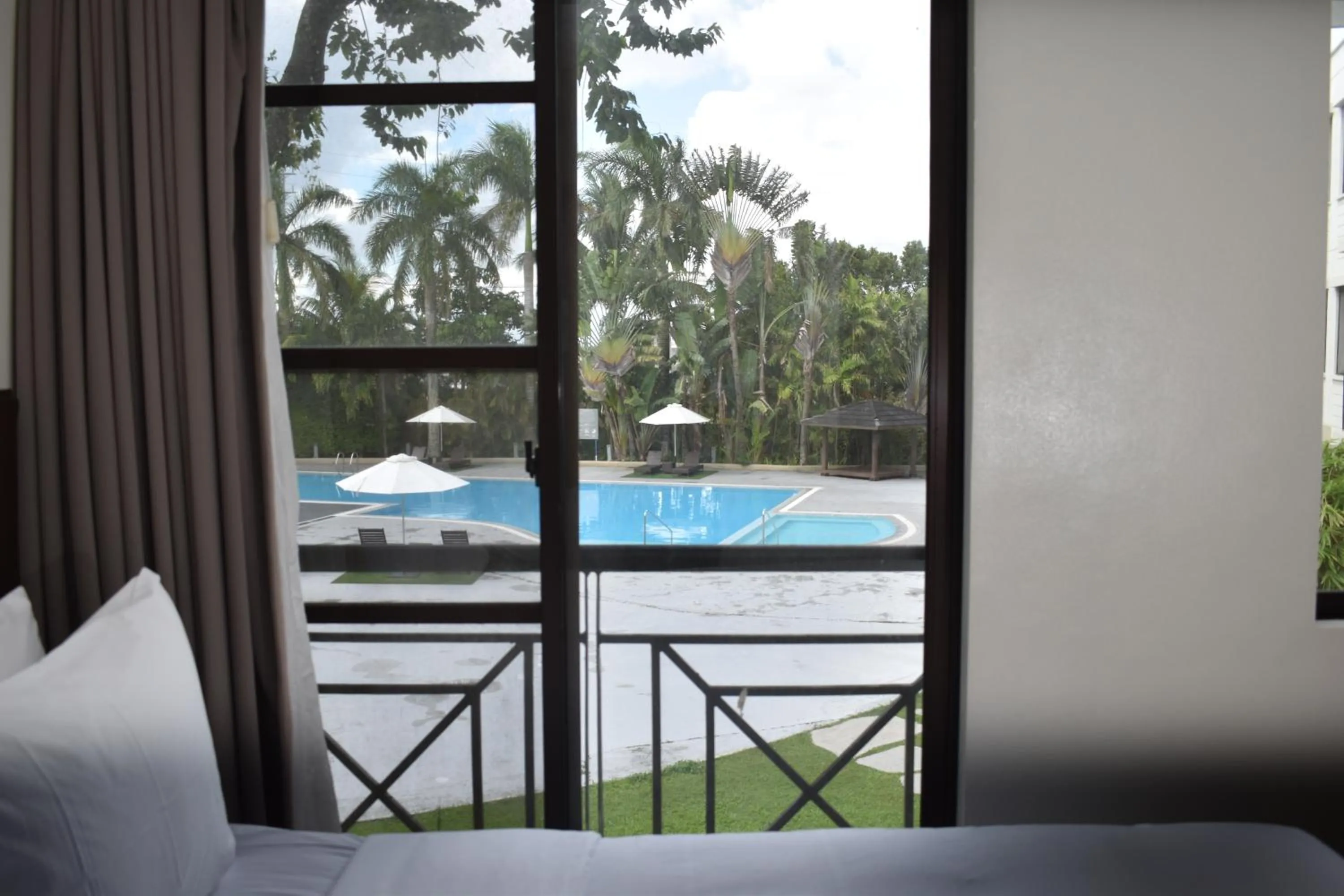 Pool view in Holiday Inn & Suites Batangas LimaPark by IHG