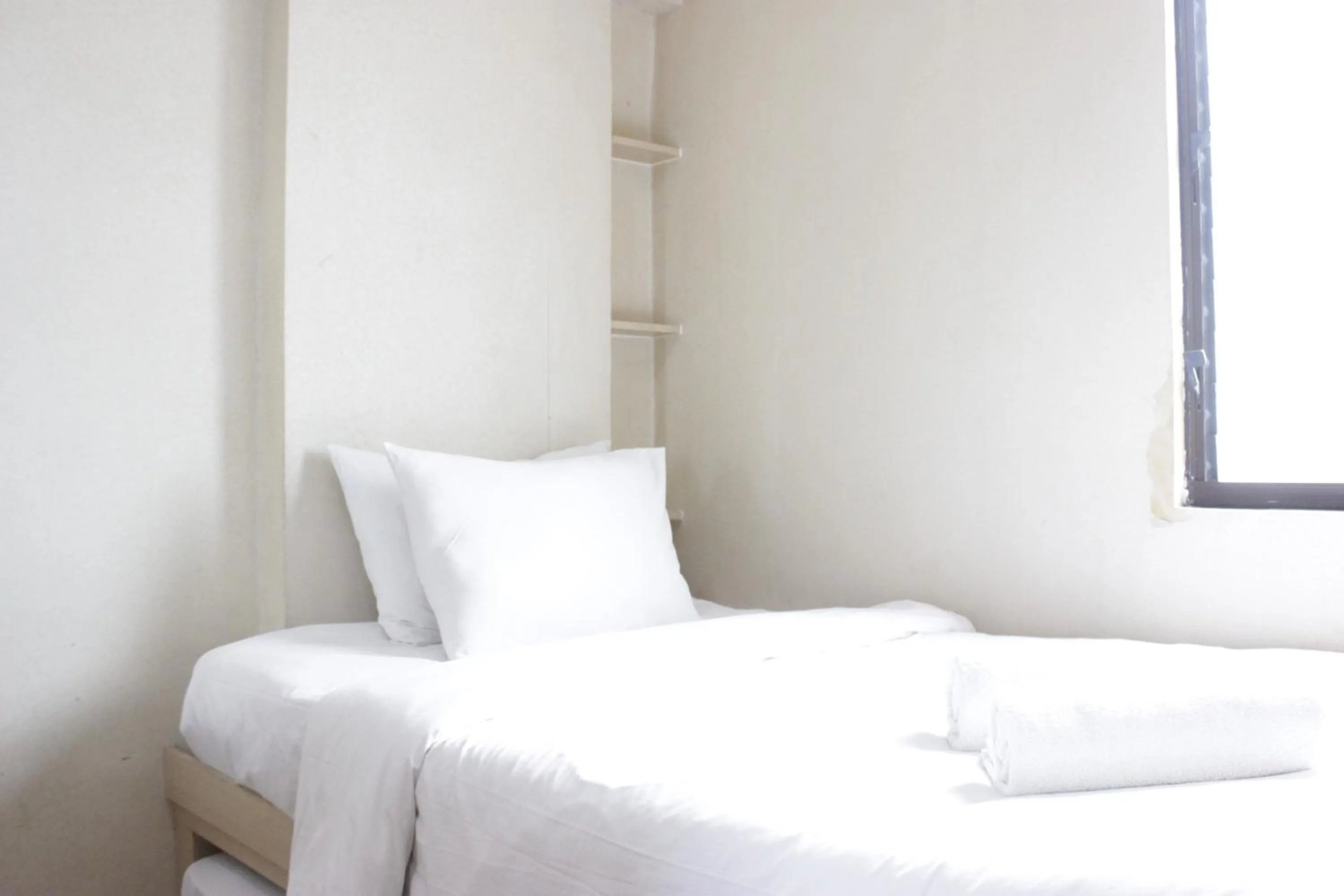 Bed in Private & Stylish 2BR at Gateway Apartment Ahmad Yani Cicadas By Travelio