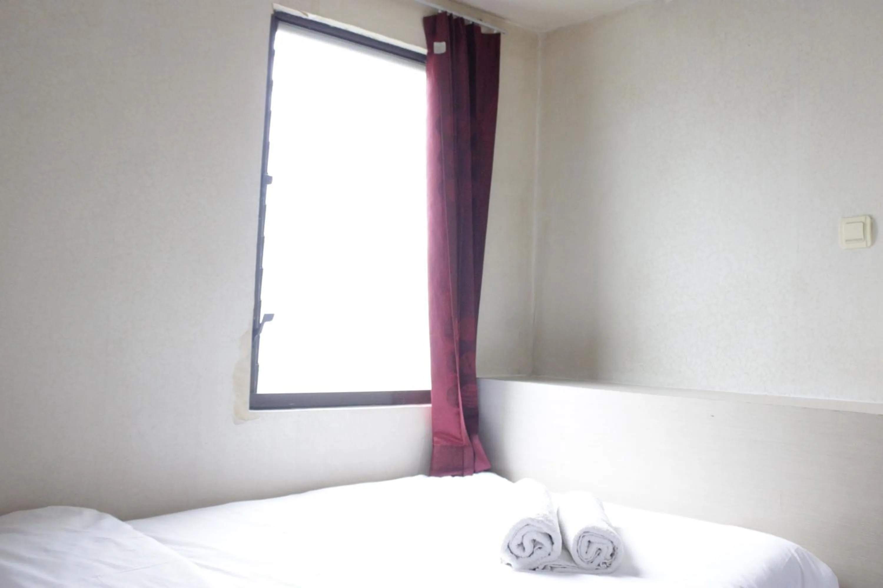 Bed in Private & Stylish 2BR at Gateway Apartment Ahmad Yani Cicadas By Travelio