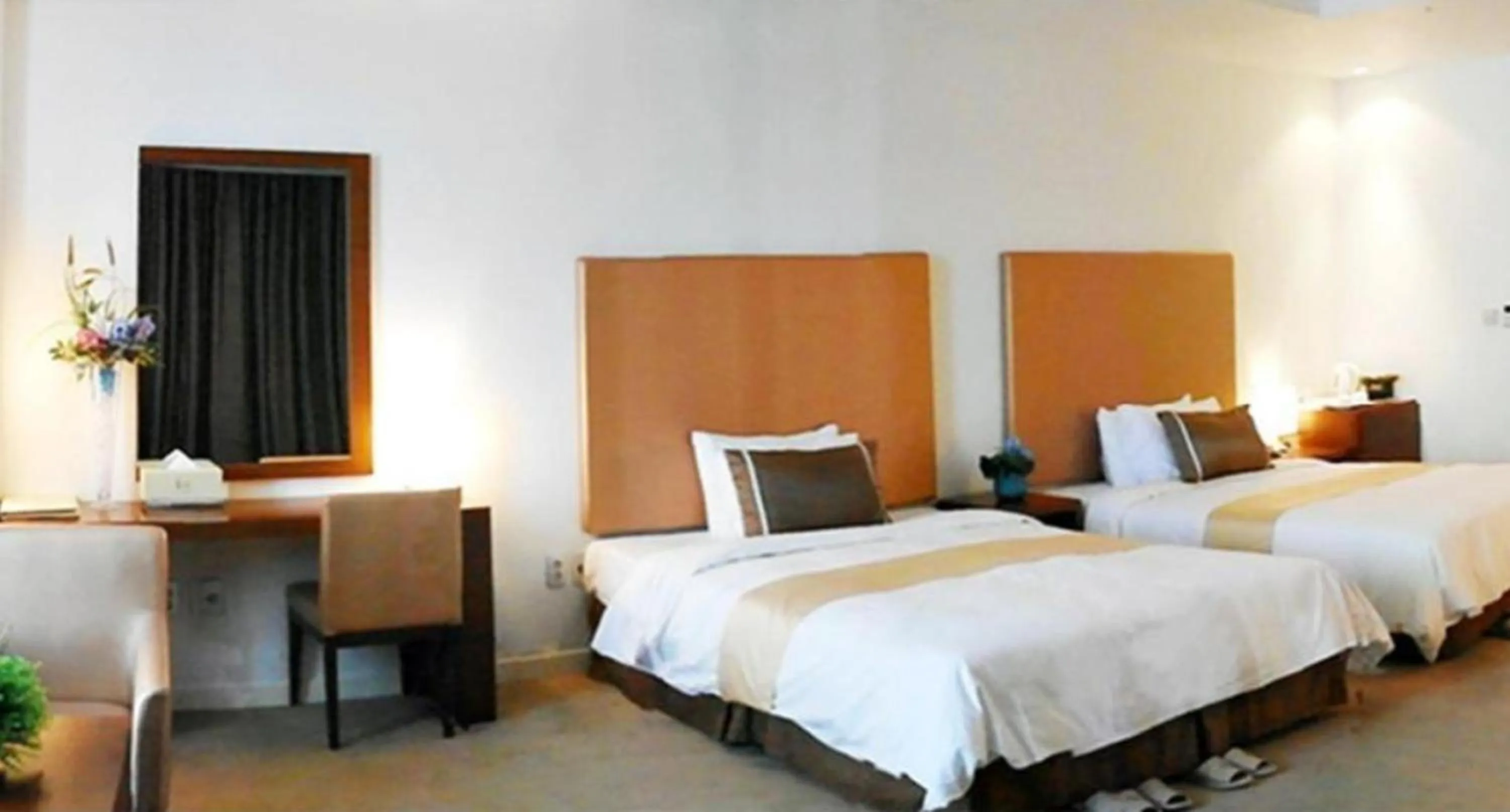 Bed in Ecograd Hotel