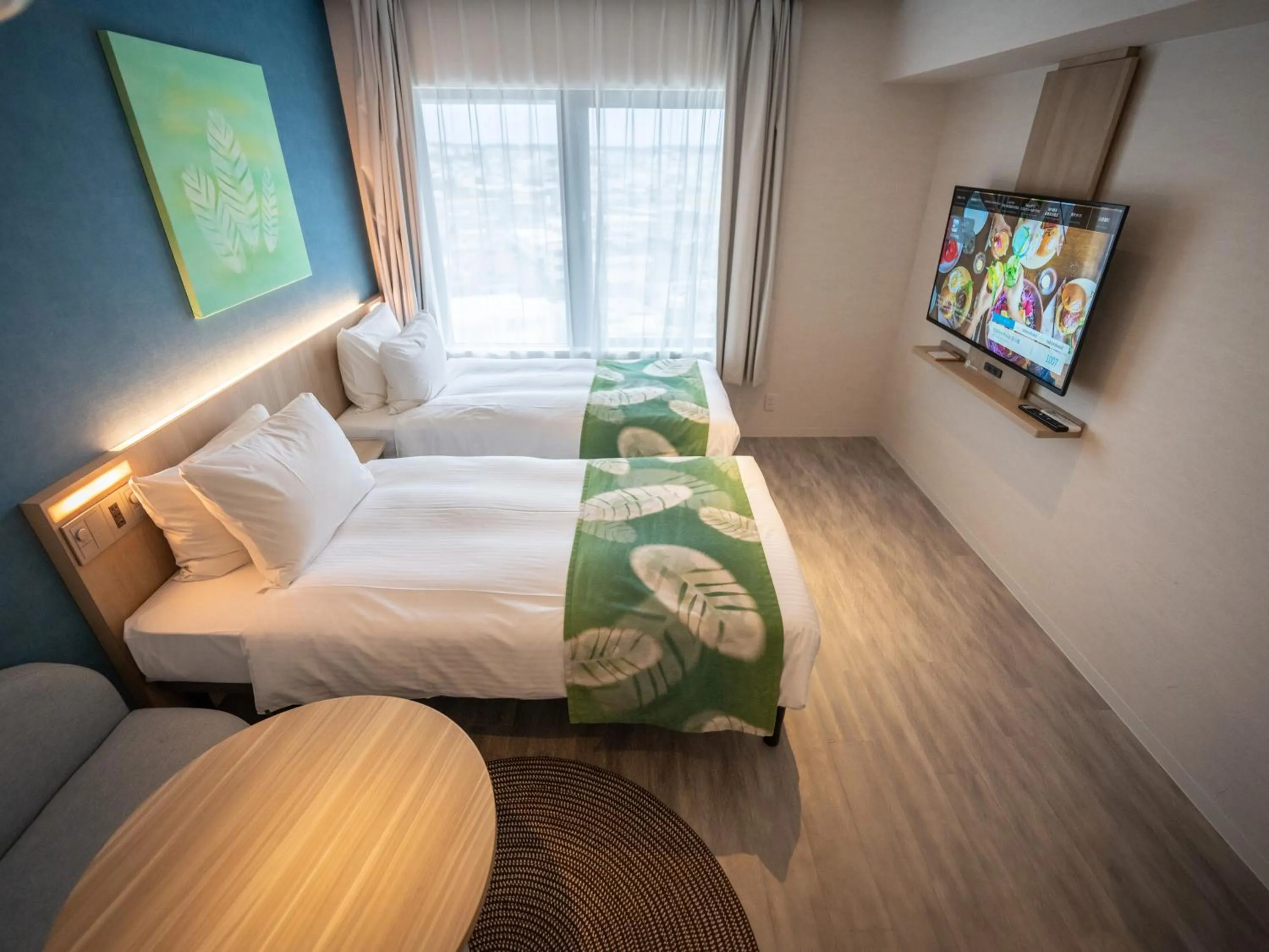 Photo of the whole room, Bed in Tabino Hotel lit Miyakojima