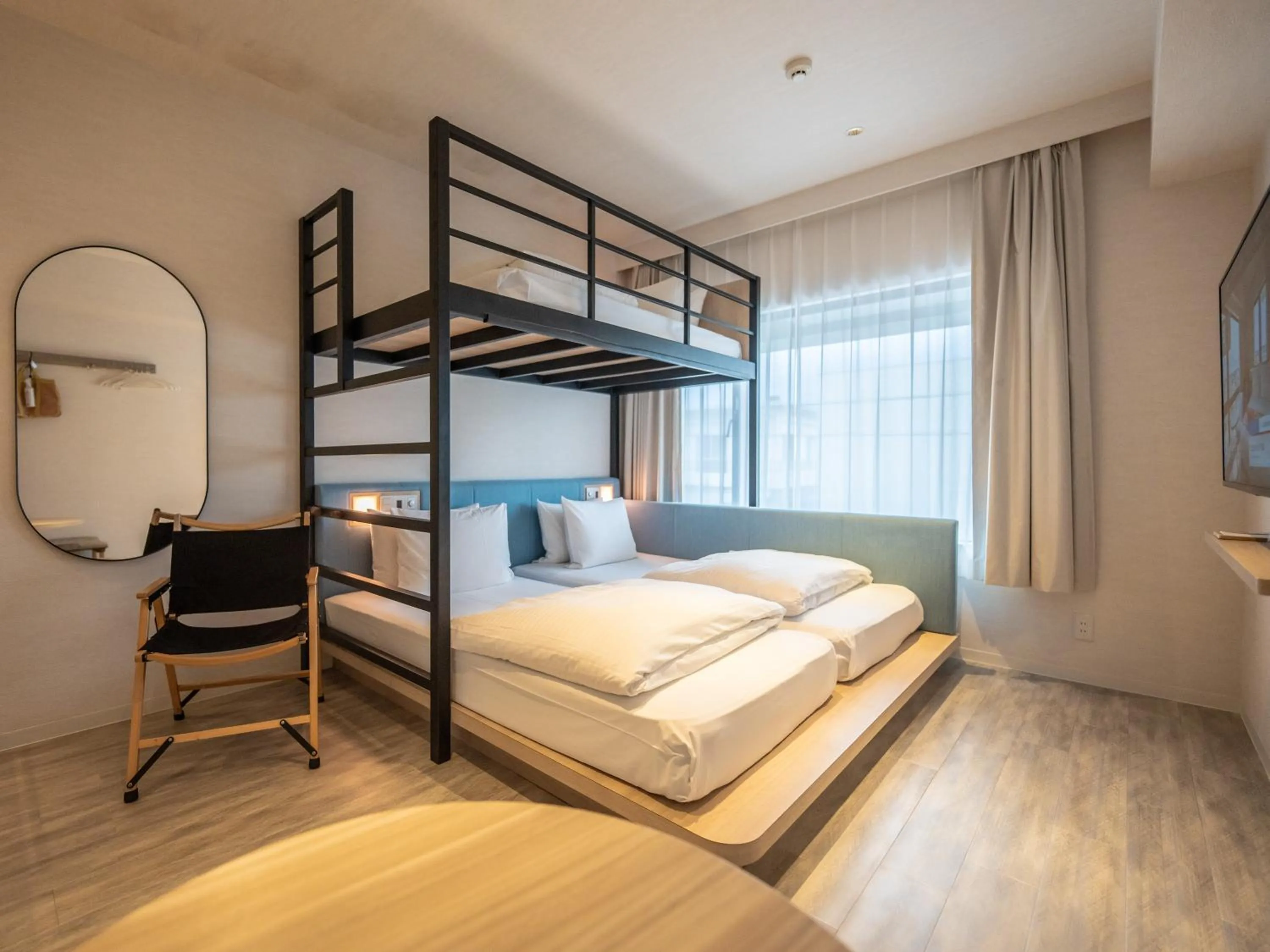 Photo of the whole room, Bed in Tabino Hotel lit Miyakojima