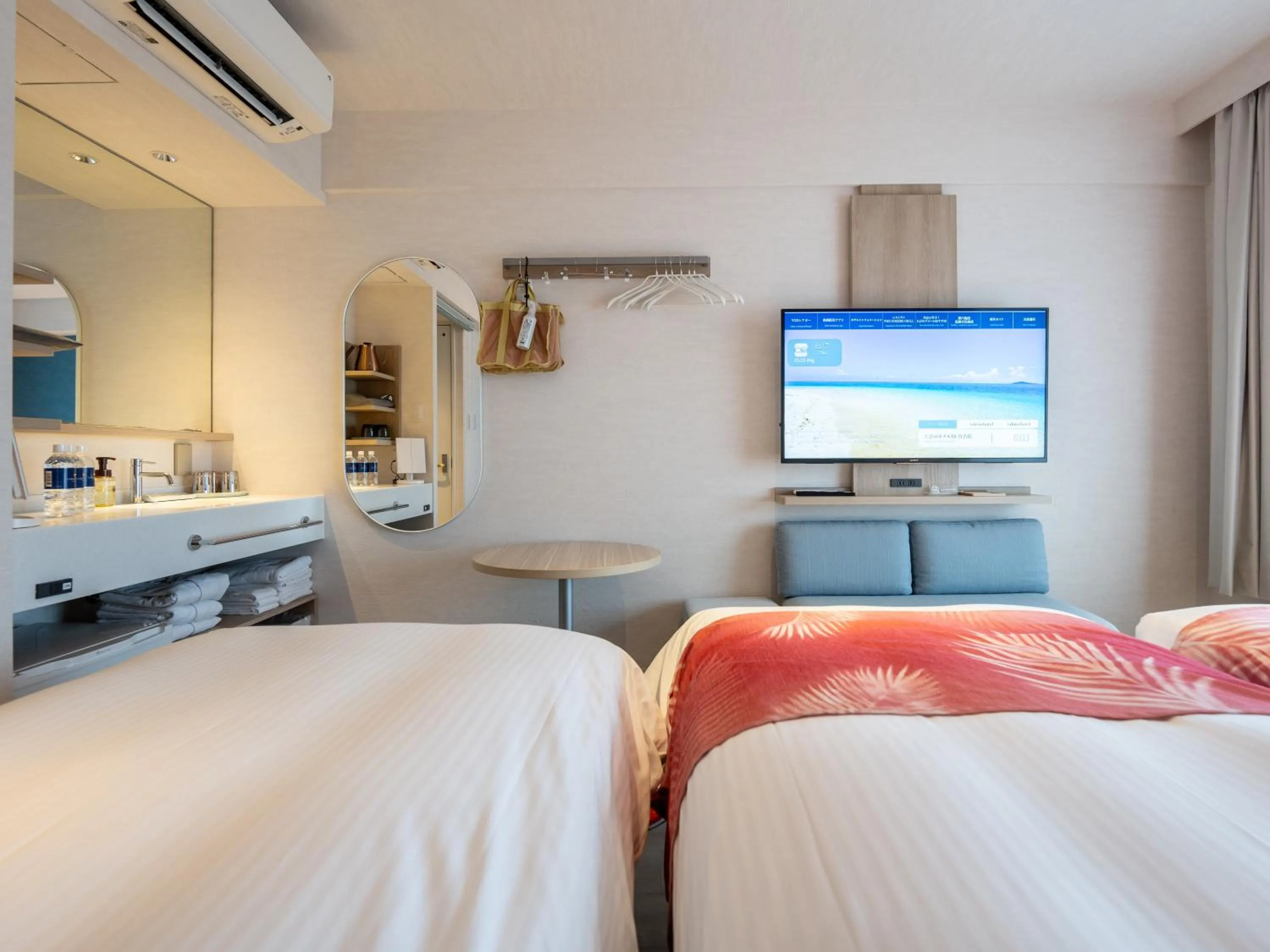 Photo of the whole room, Bed in Tabino Hotel lit Miyakojima