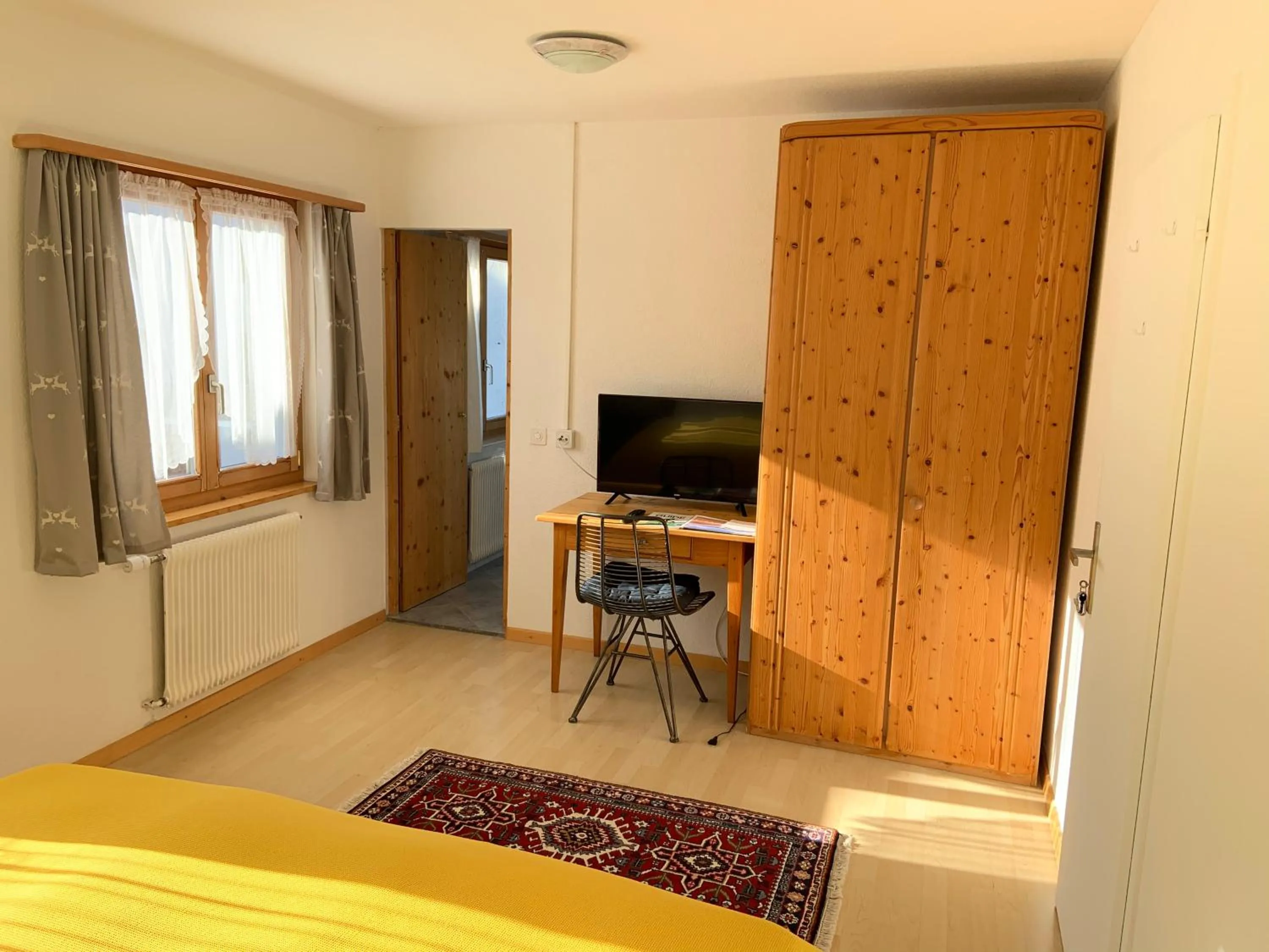 Photo of the whole room, Bed in Waldheim Laax Pension