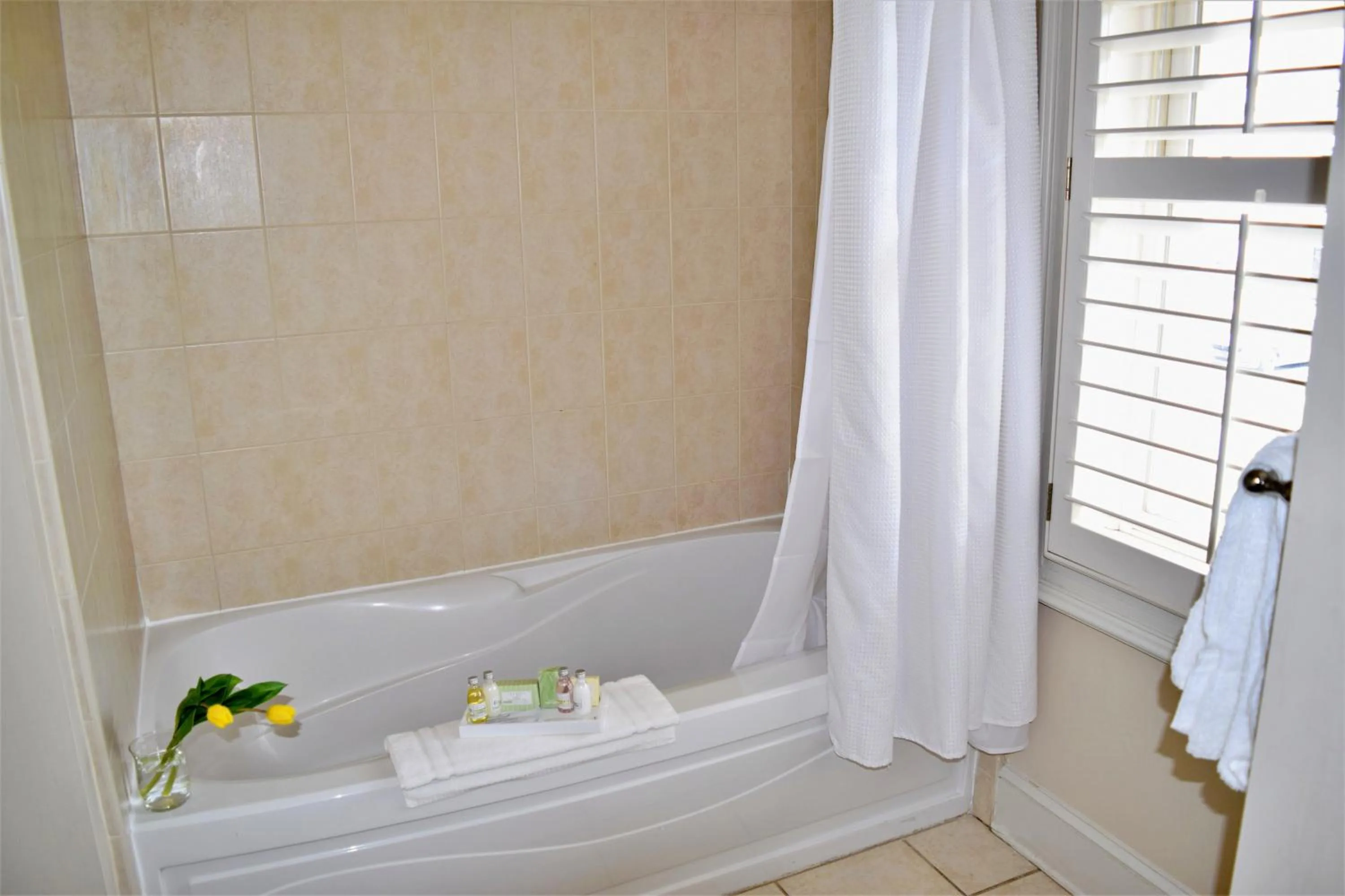 Bathroom in JH Adams Inn, Trademark Collection by Wyndham