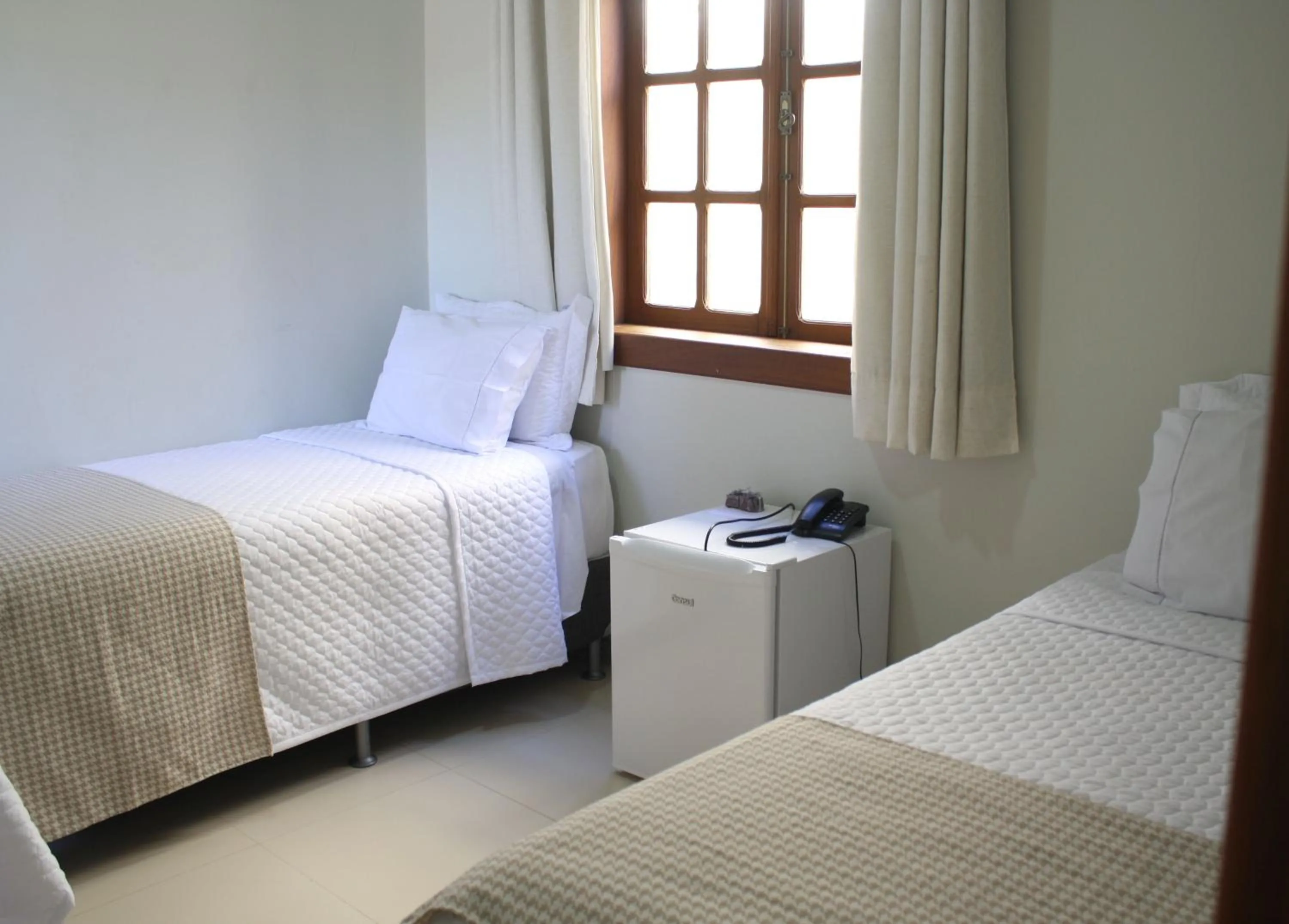 Bed in POUSADA CAPIM LIMÃO