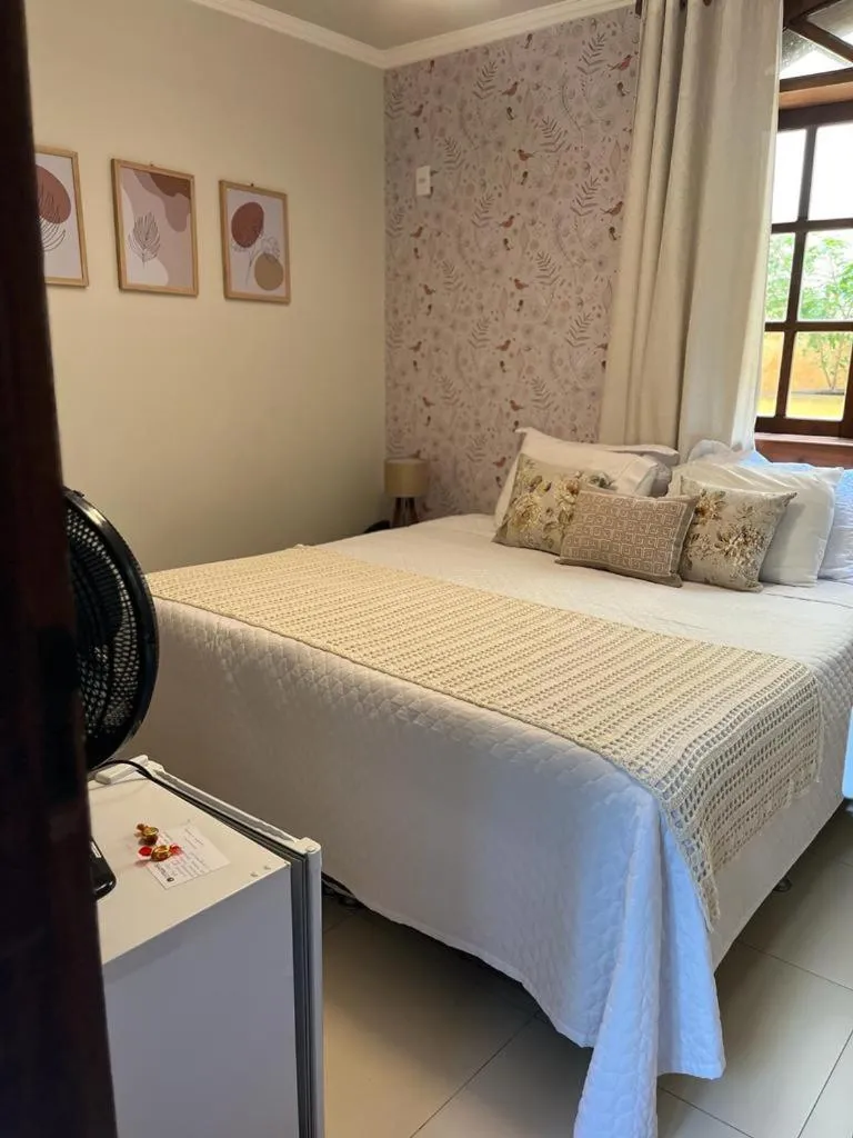 Bed in POUSADA CAPIM LIMÃO