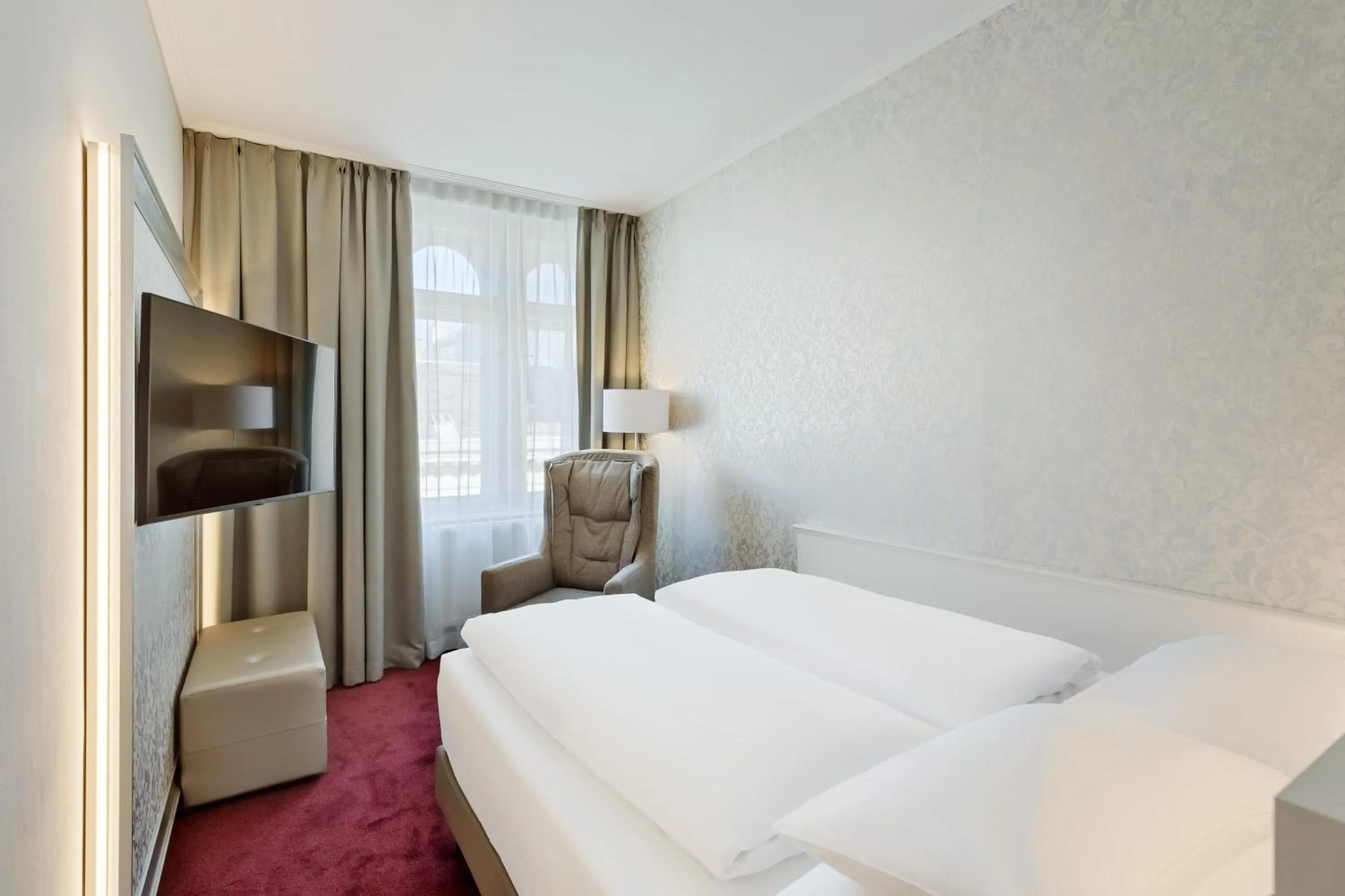 Bed in Hotel Rathauspark Wien, a member of Radisson Individuals
