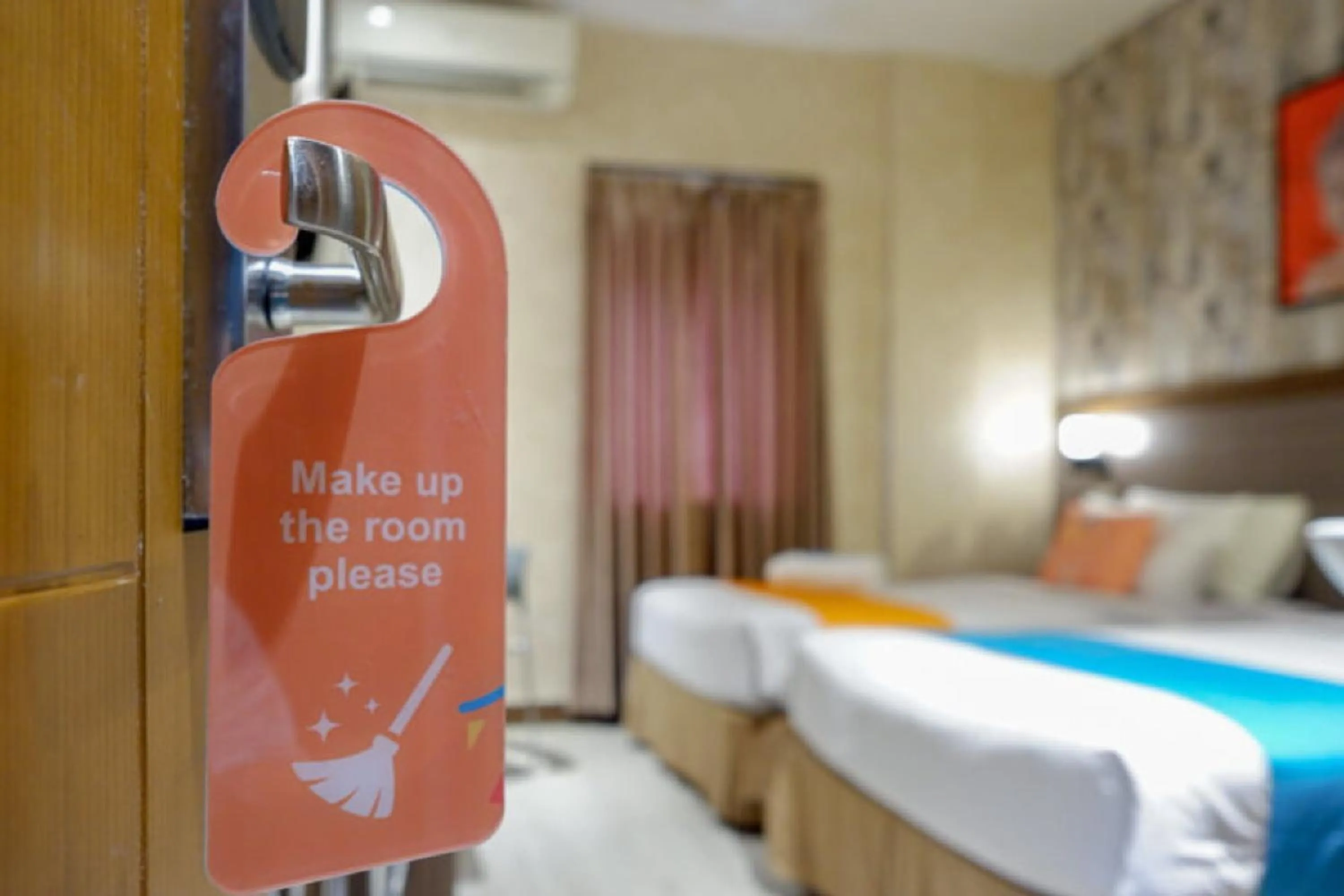 Bed in Sans Hotel Ekkon Yogyakarta by Reddoorz