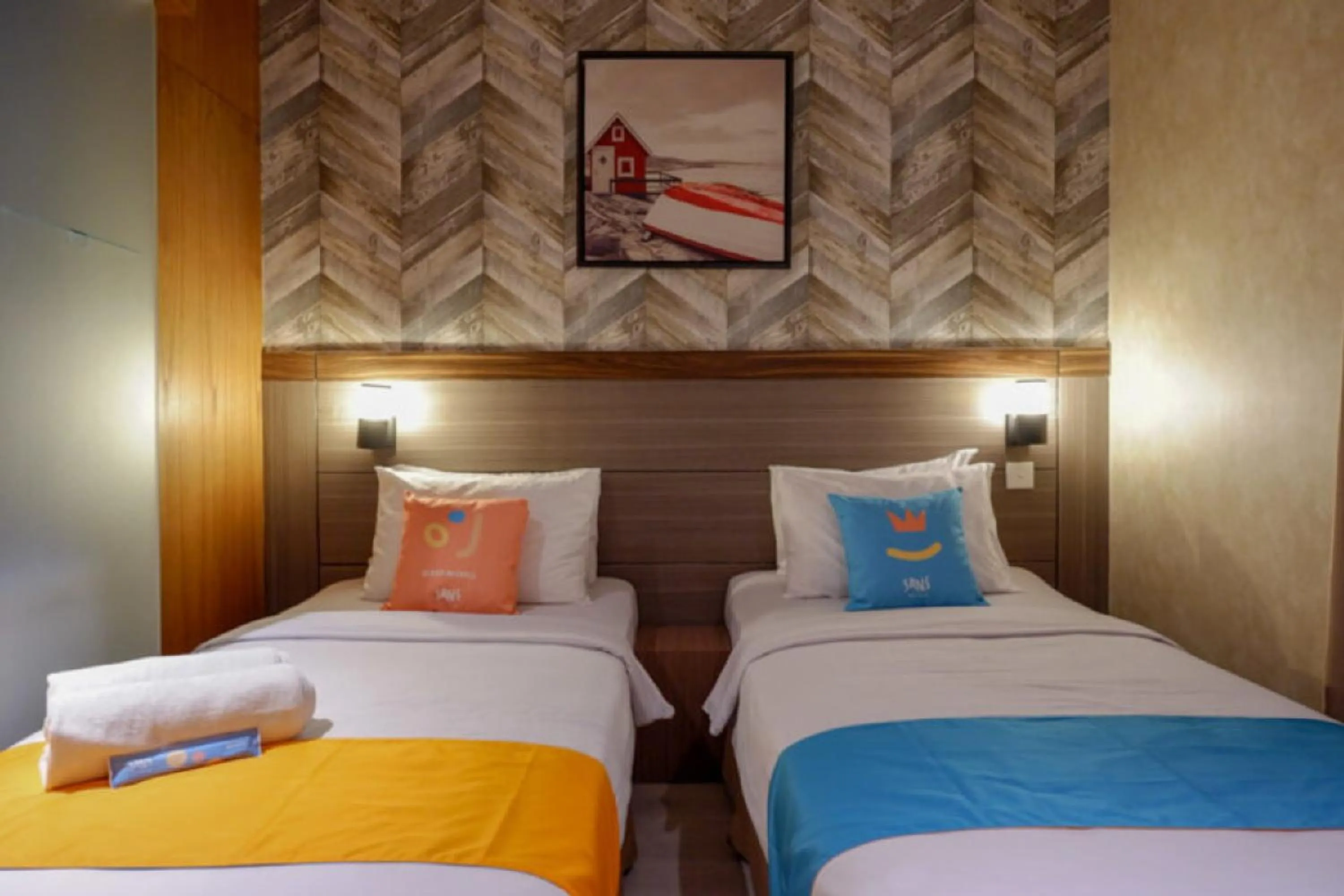 Bed in Sans Hotel Ekkon Yogyakarta by Reddoorz