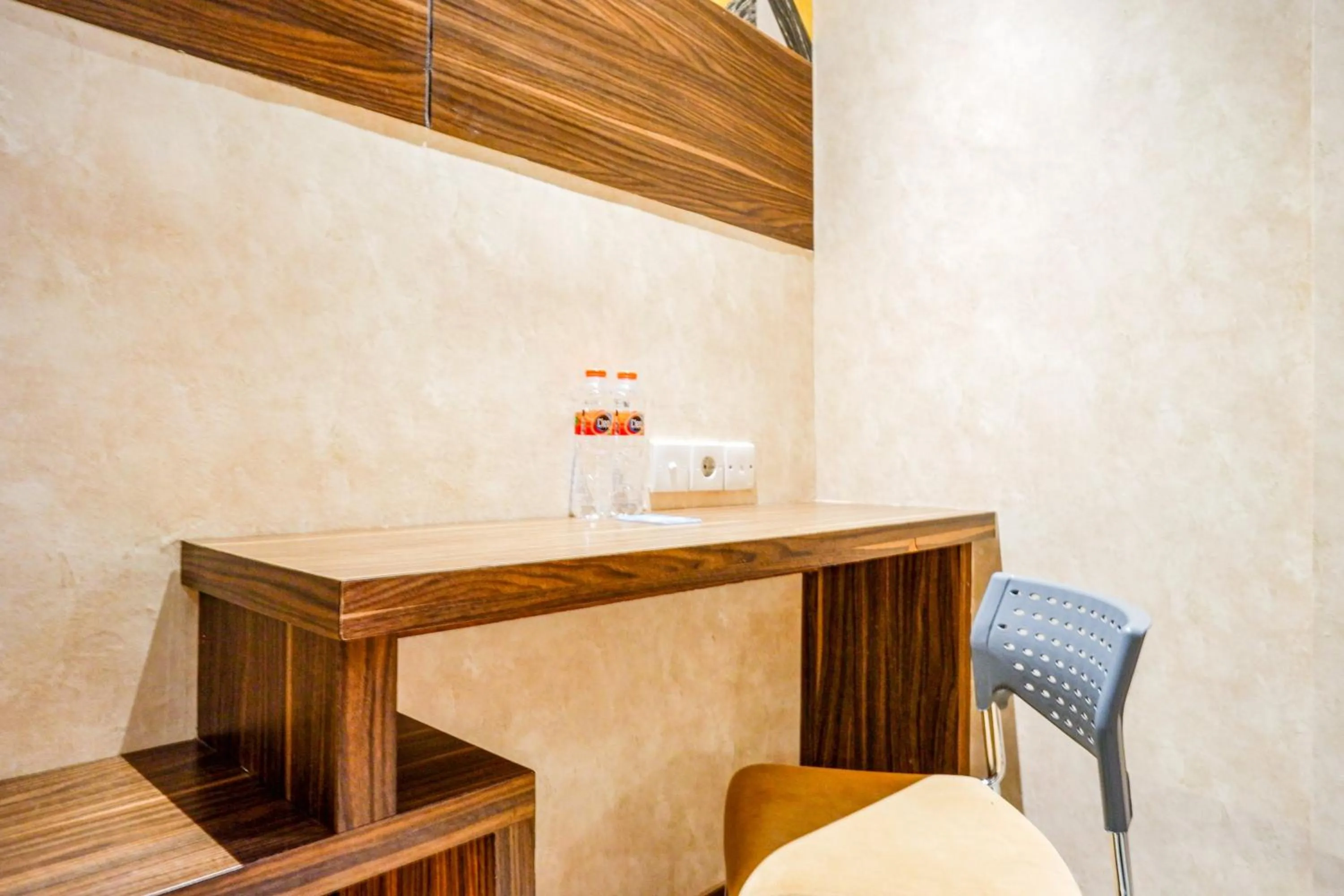 Seating area in Sans Hotel Ekkon Yogyakarta by Reddoorz