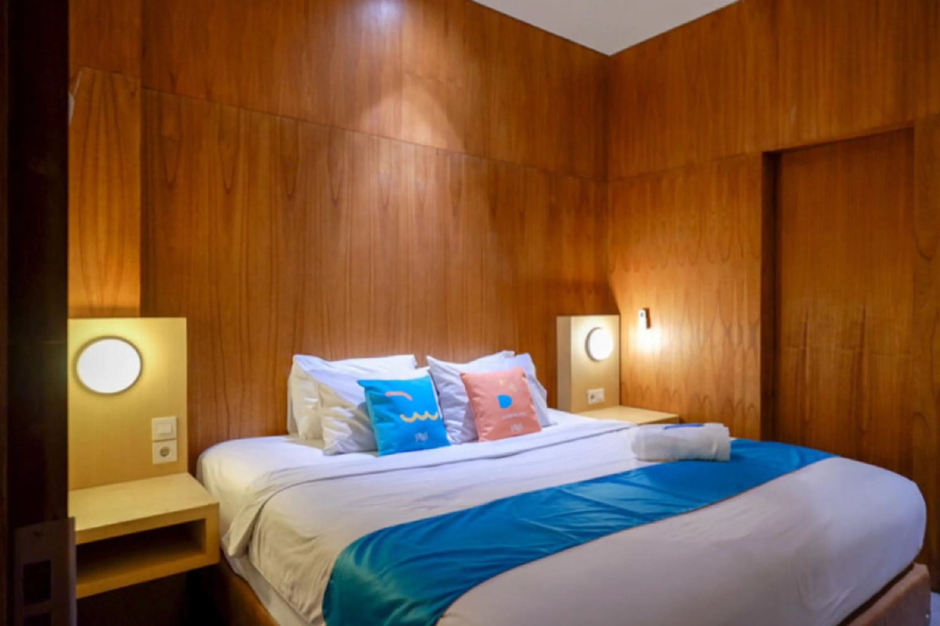 Bed in Sans Hotel Ekkon Yogyakarta by Reddoorz