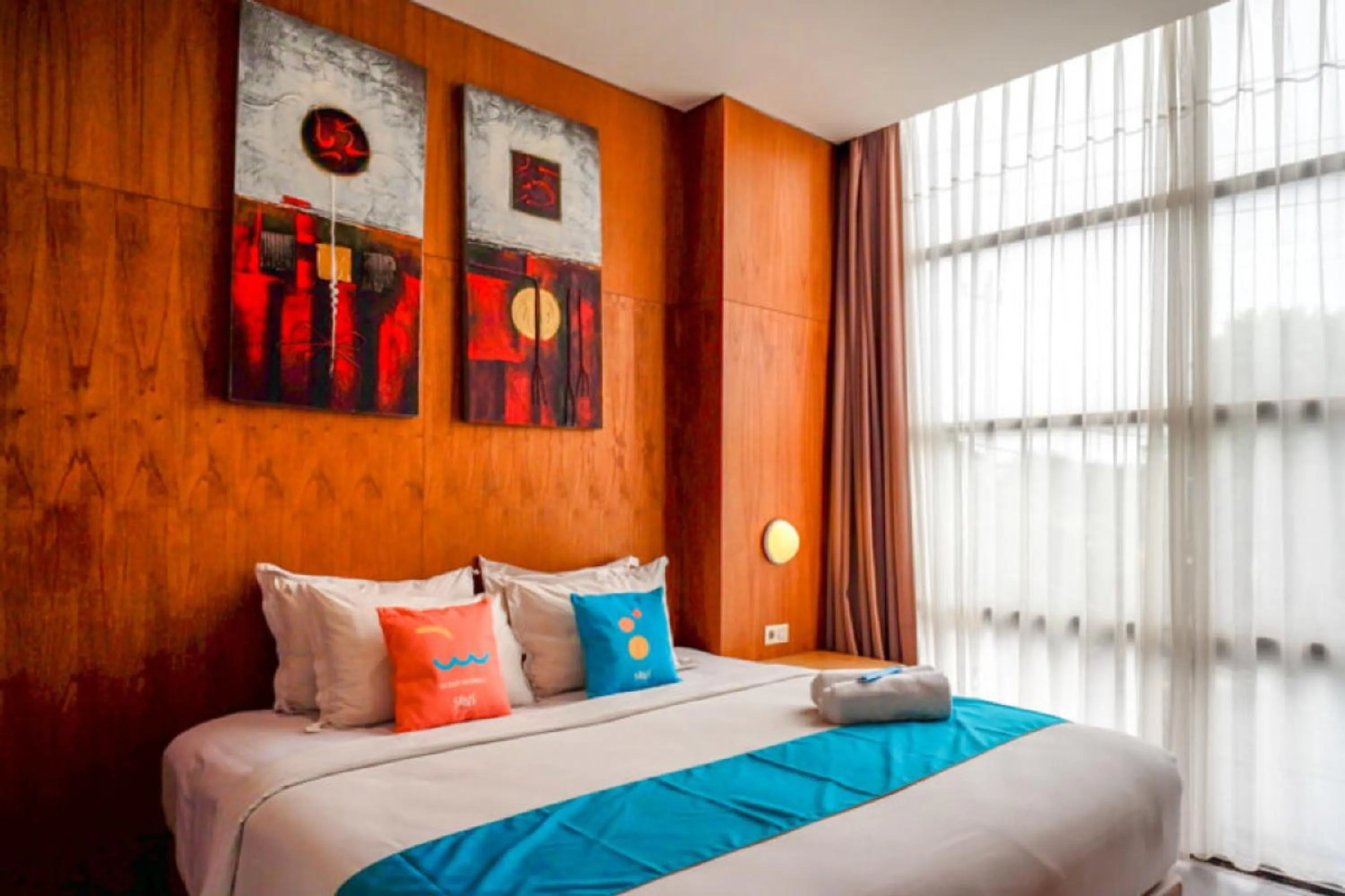 Bed in Sans Hotel Ekkon Yogyakarta by Reddoorz