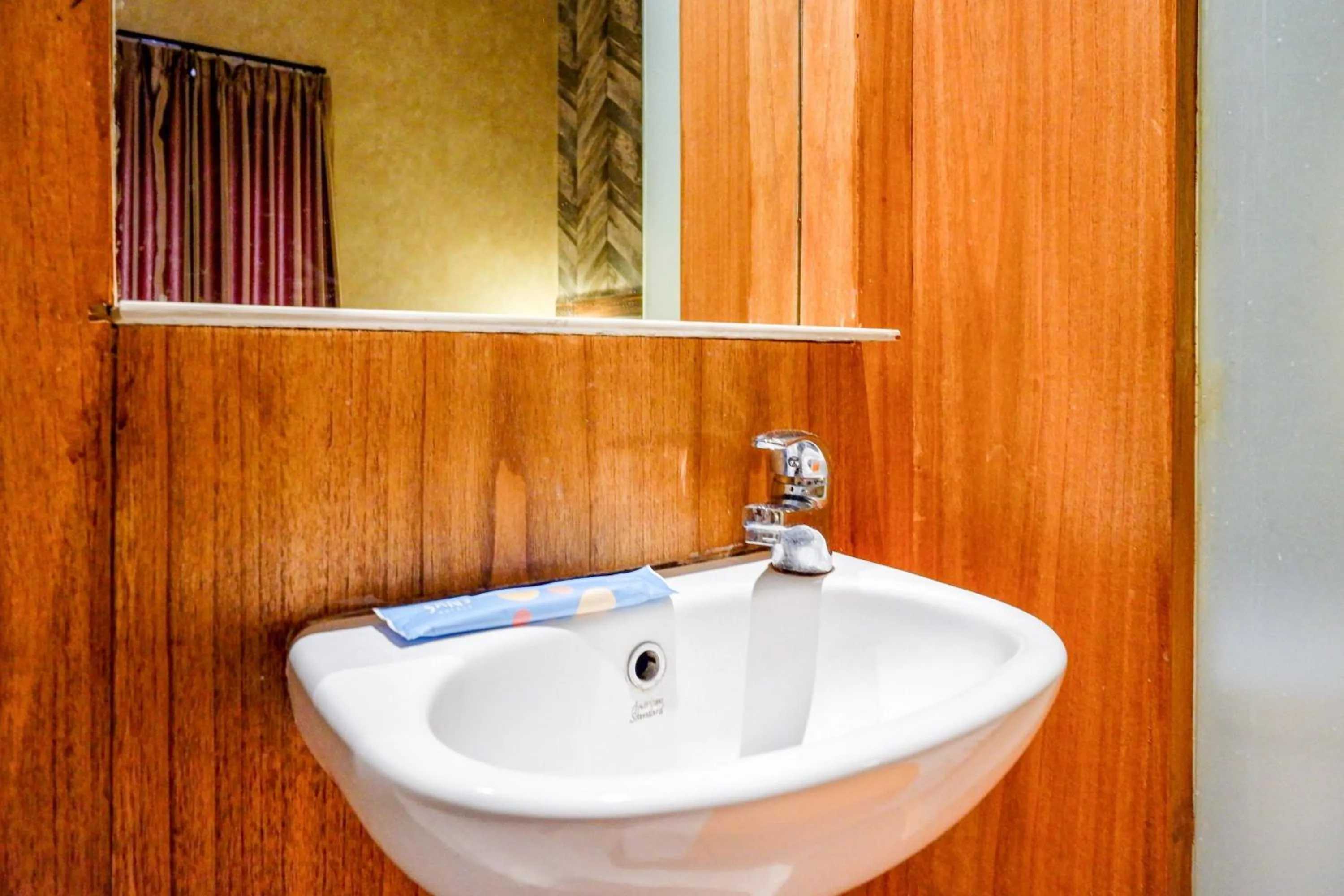 Bathroom in Sans Hotel Ekkon Yogyakarta by Reddoorz