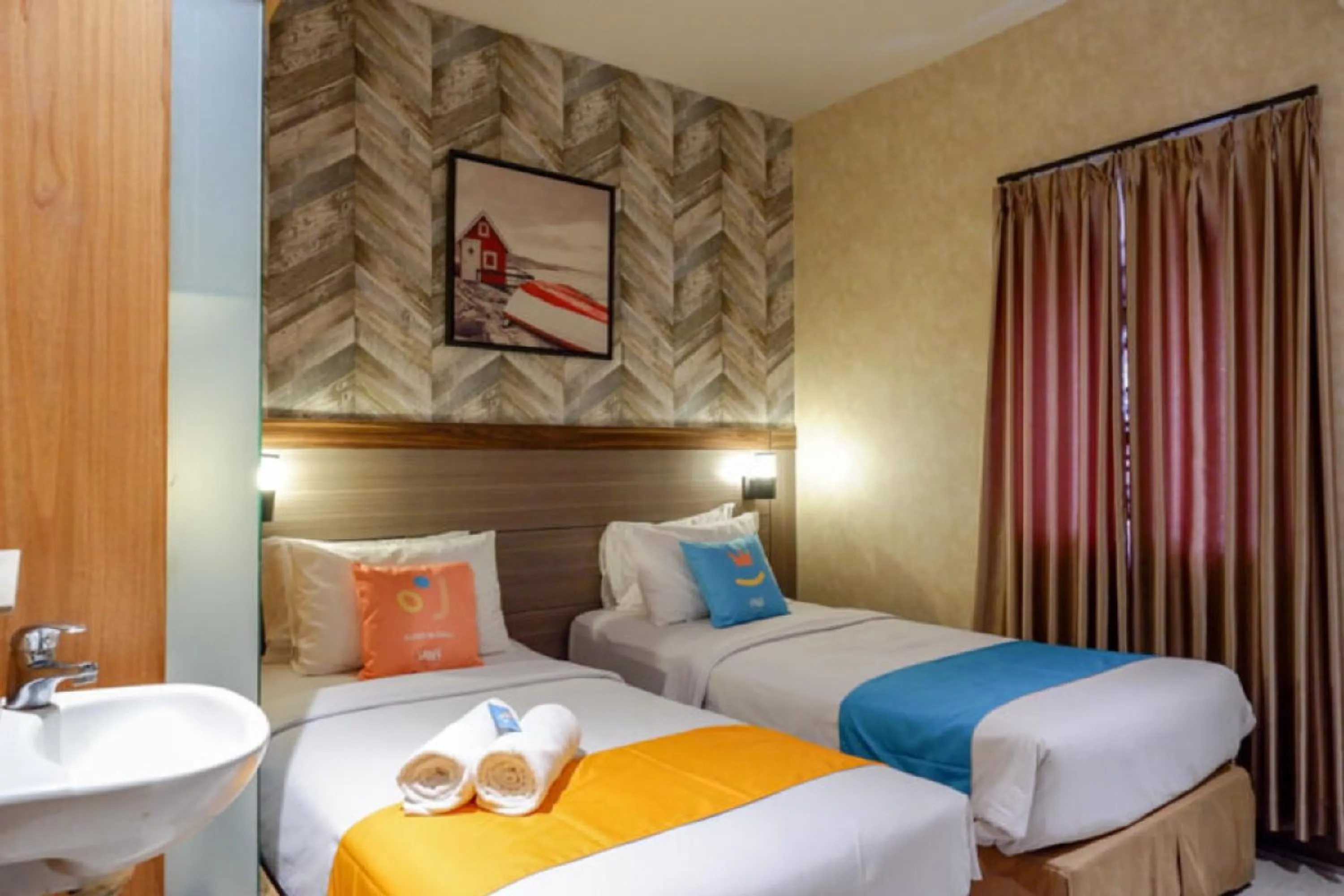 Bed in Sans Hotel Ekkon Yogyakarta by Reddoorz