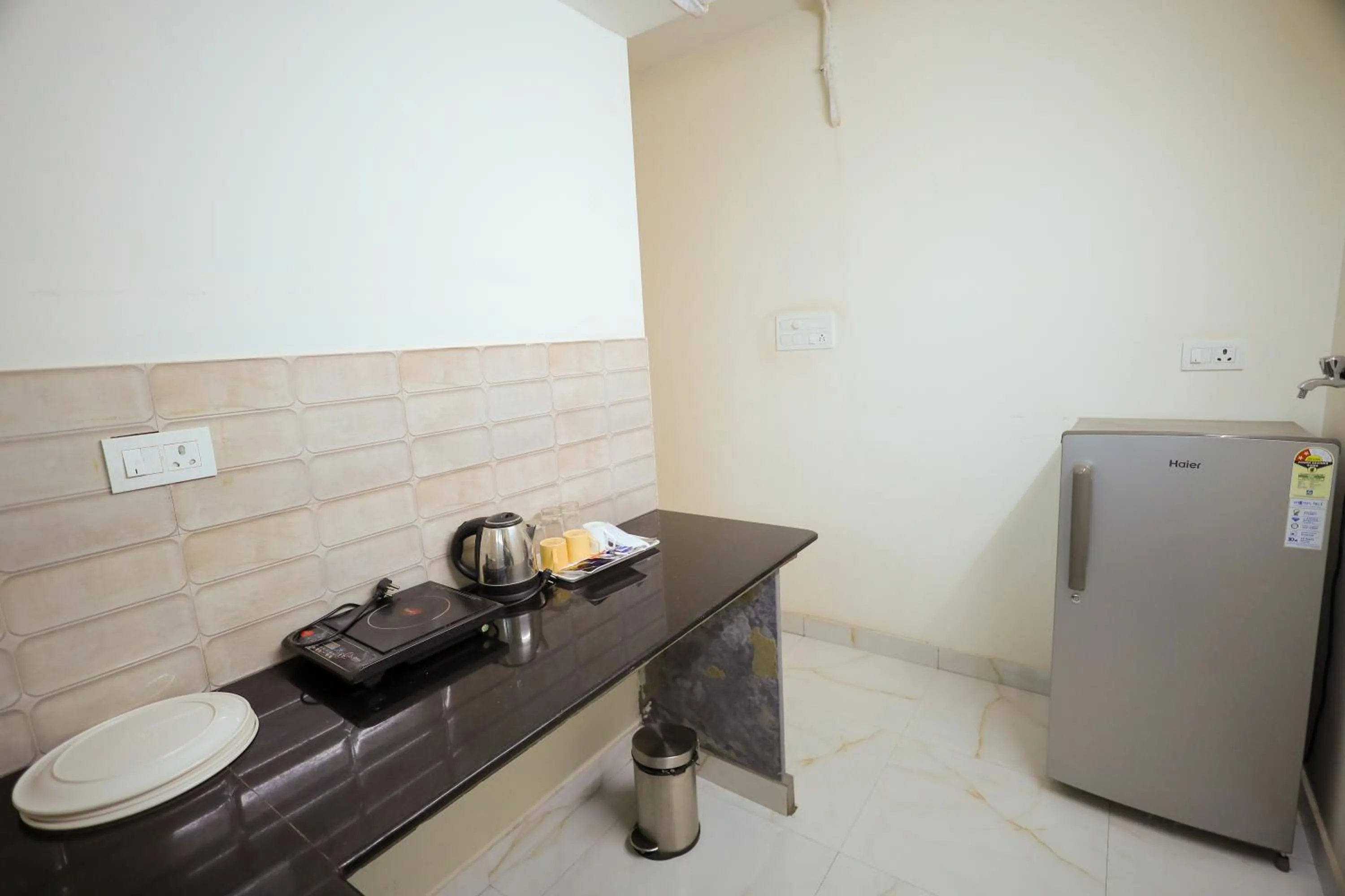 kitchen in Adyar Plaza Inn by RAK Rooms, Mangaluru