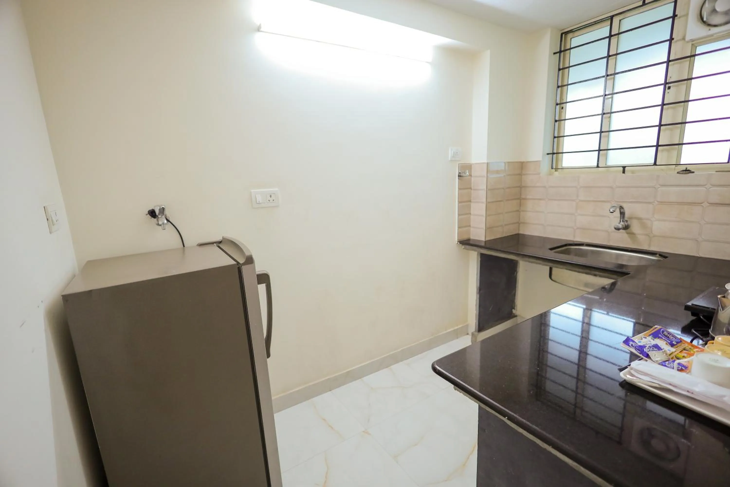 kitchen in Adyar Plaza Inn by RAK Rooms, Mangaluru