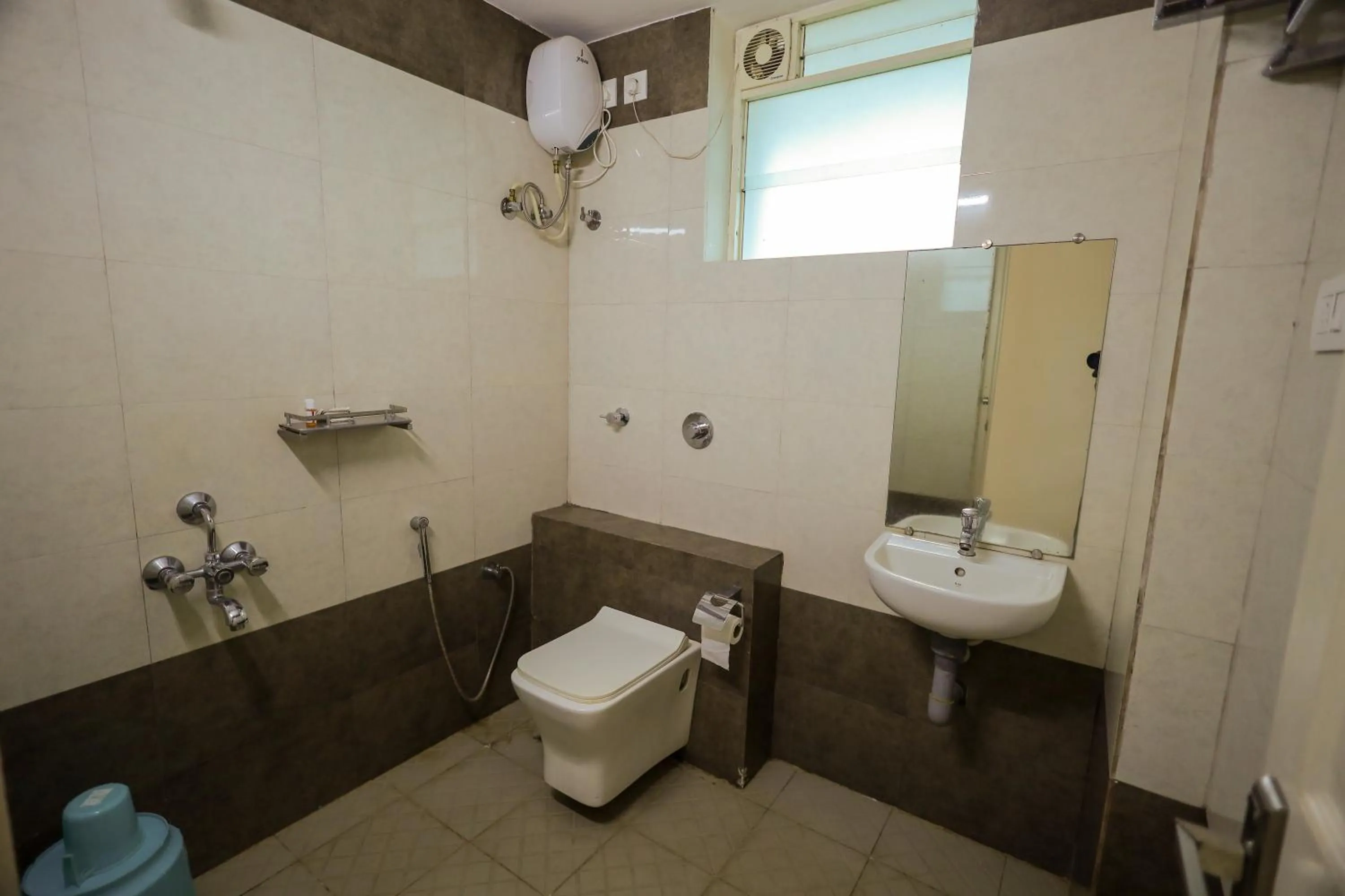 Bathroom in Adyar Plaza Inn by RAK Rooms, Mangaluru