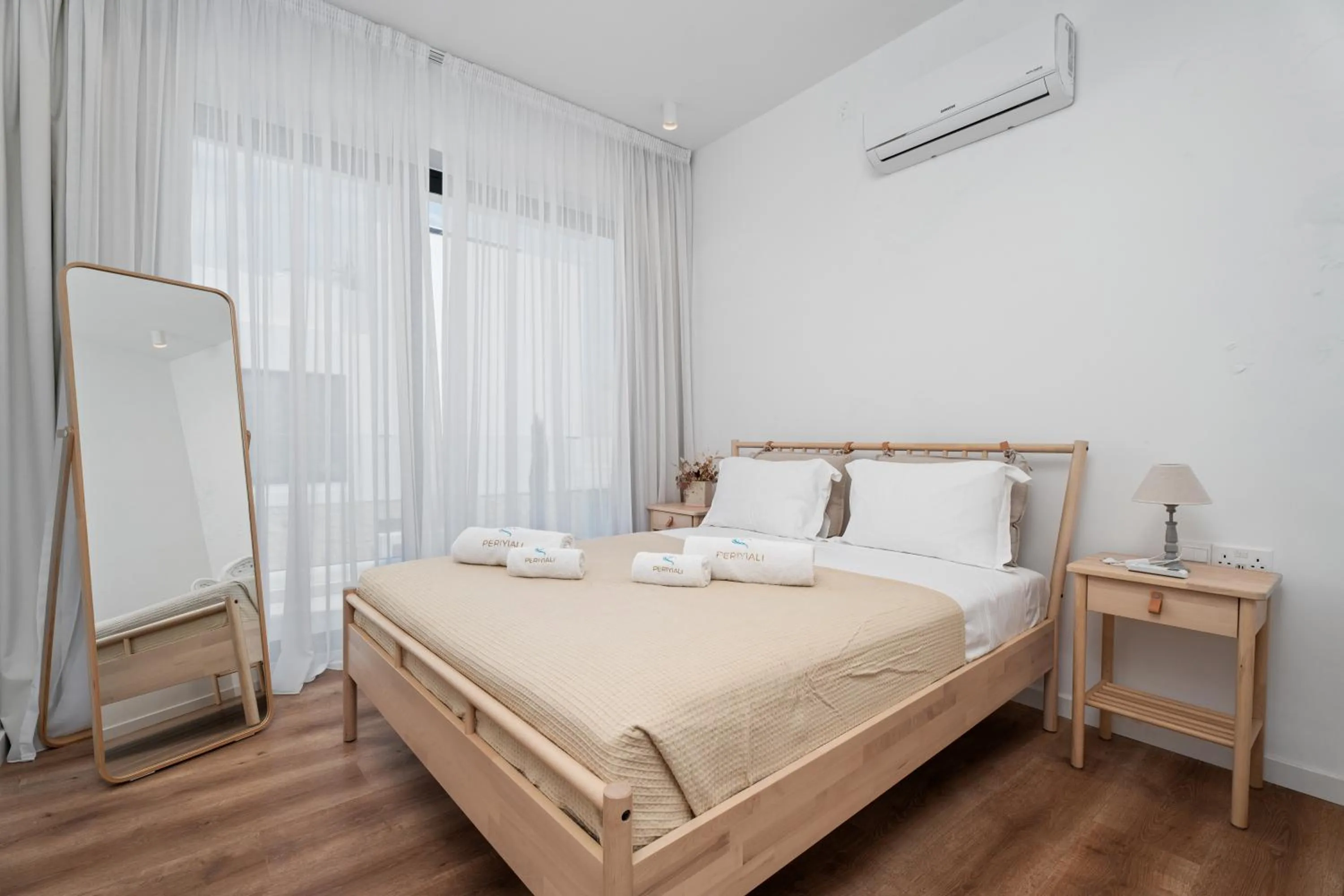 Bed in Periyiali Konnos Villas Beach Resort