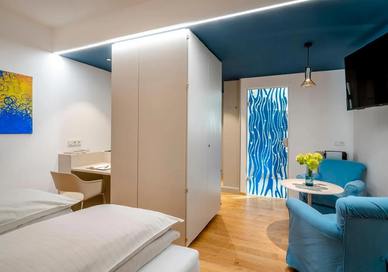 TV and multimedia, Bed in Boutique Hotel Hauser