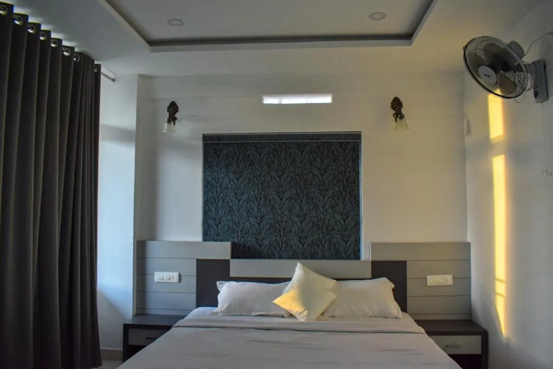 Bed in Raveendra Inn