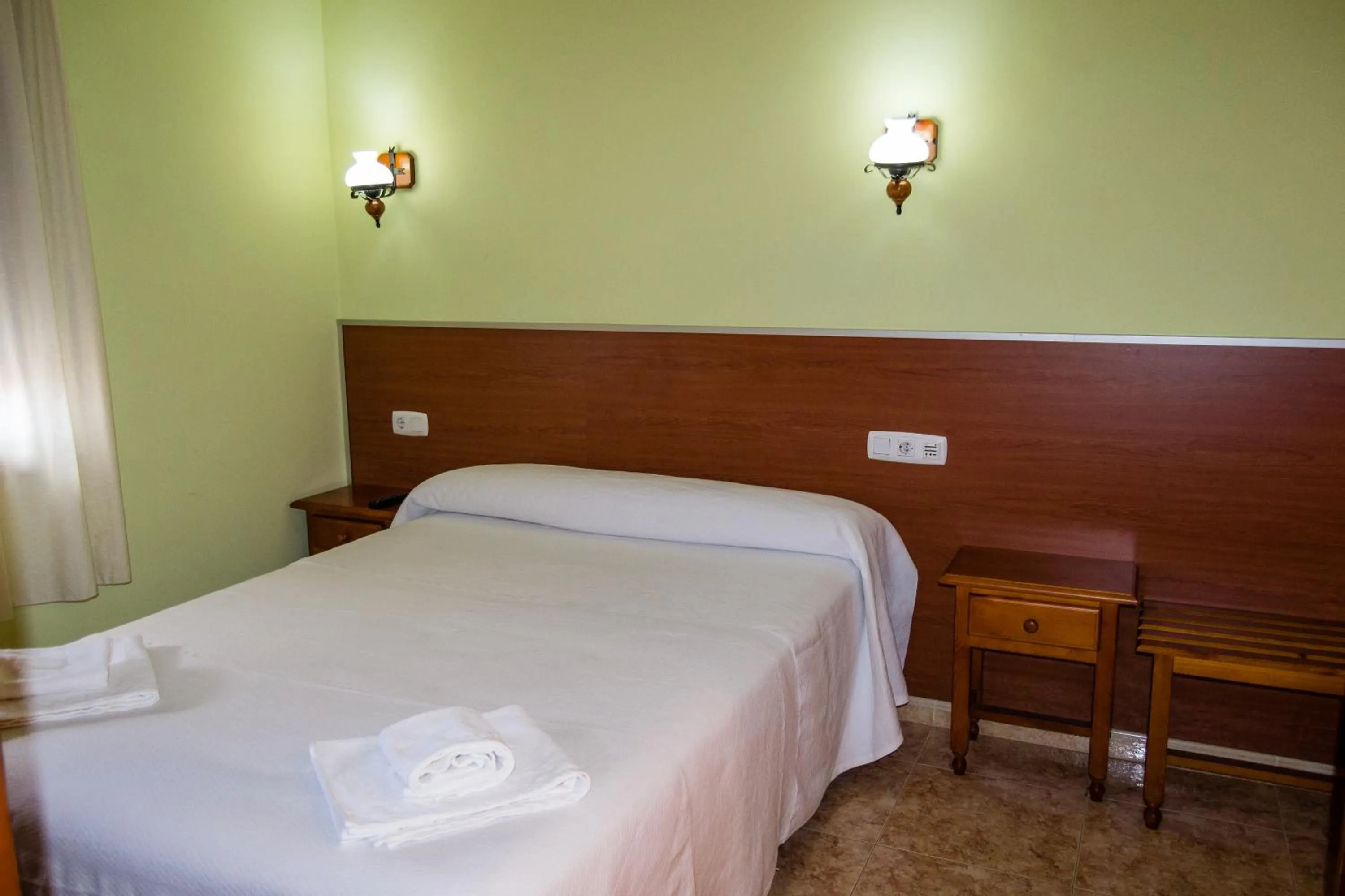 Bed in El Roble Hotel Restaurante