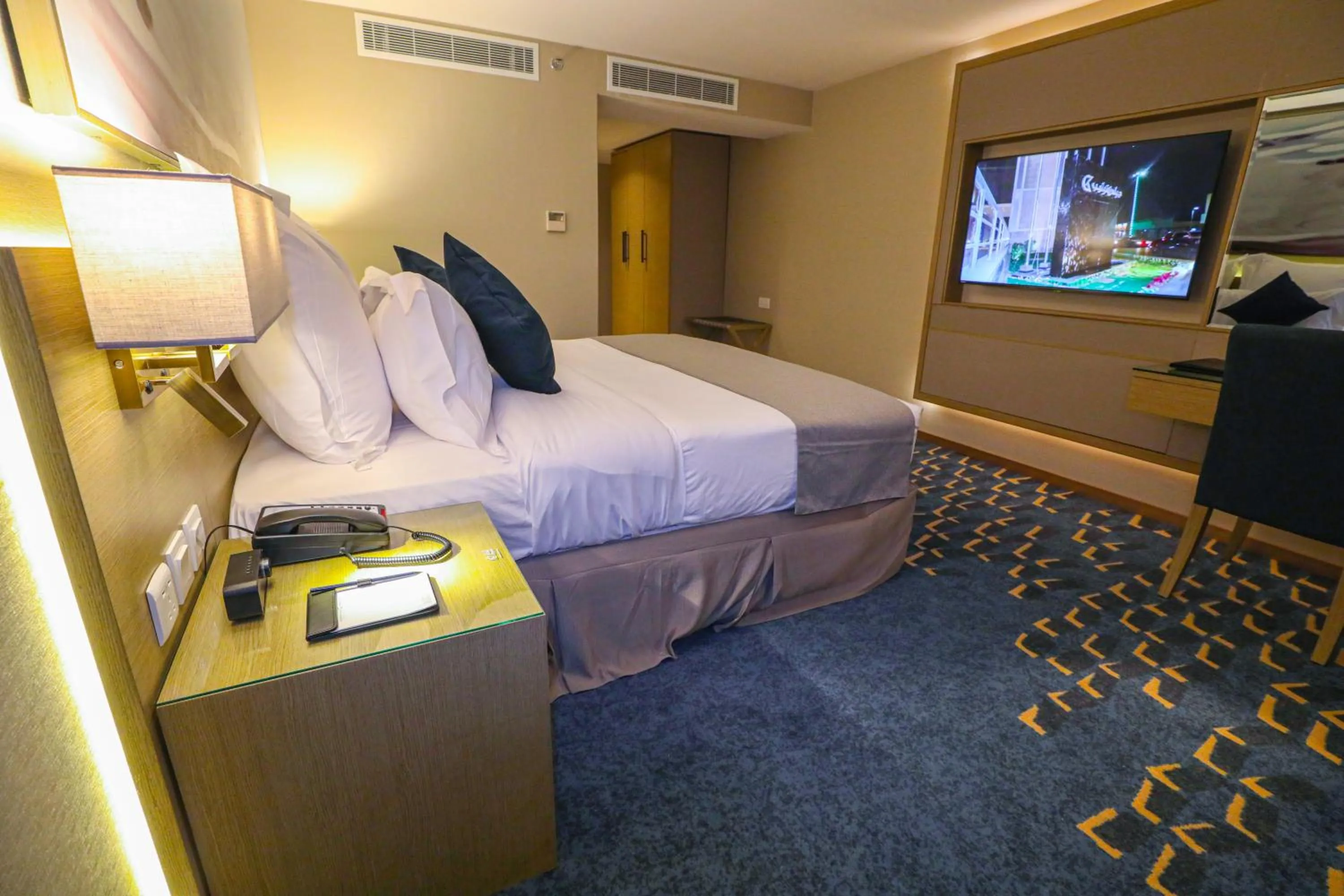 Bedroom in Cheerful Al Waha Unayzah Hotel