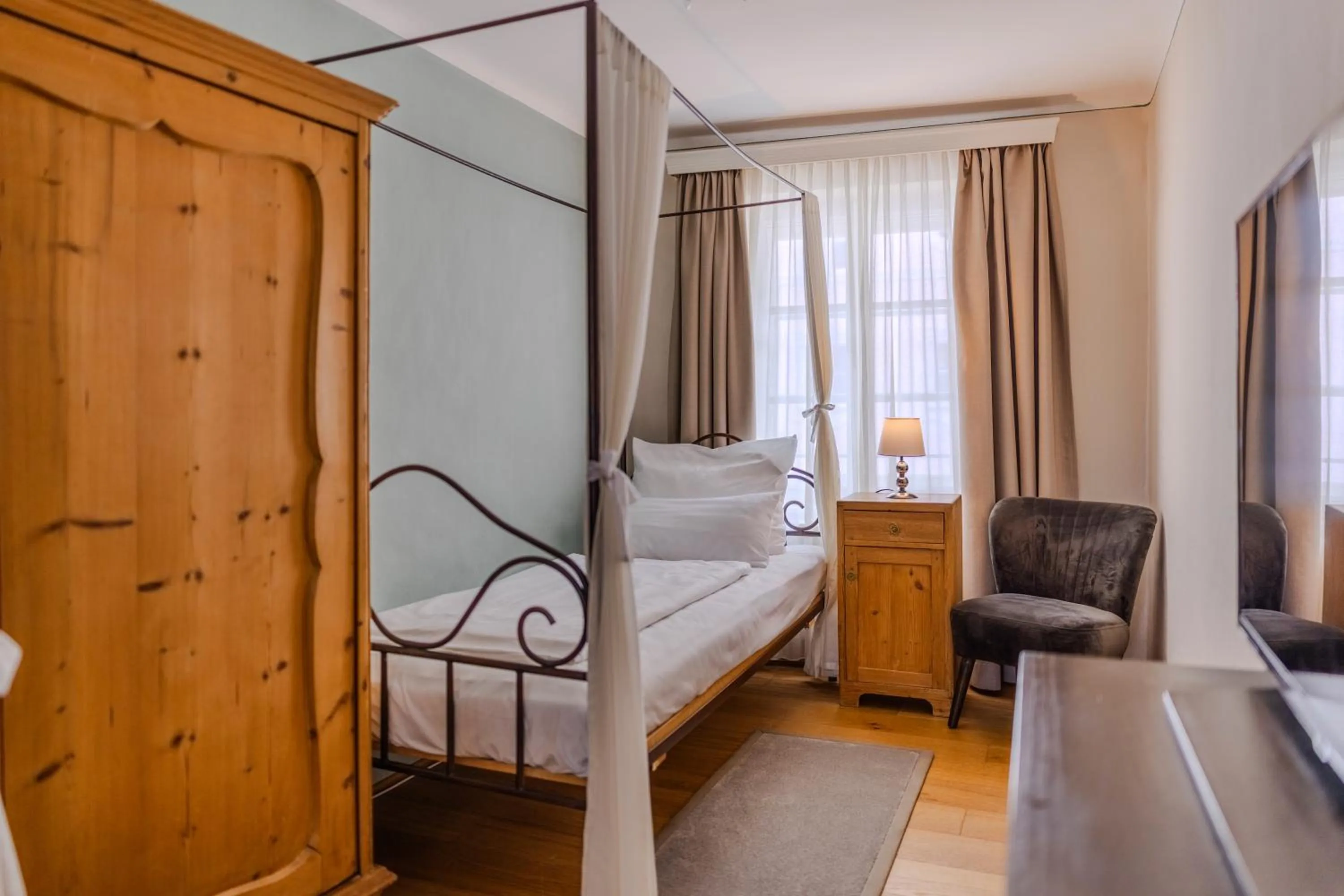 Bed in Boutiquehotel Amadeus