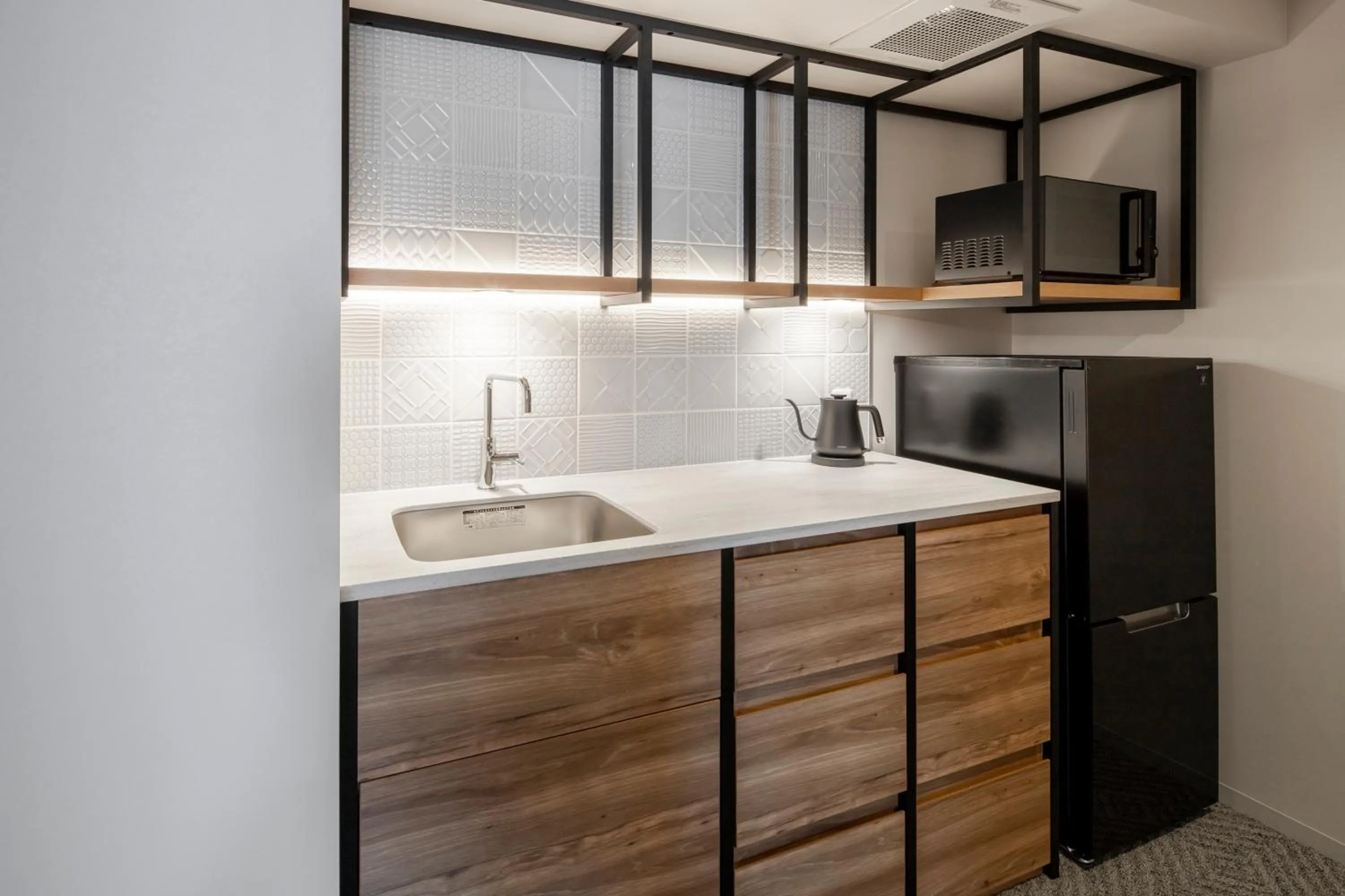 Kitchen or kitchenette in Tokyu Stay Shinjuku Eastside