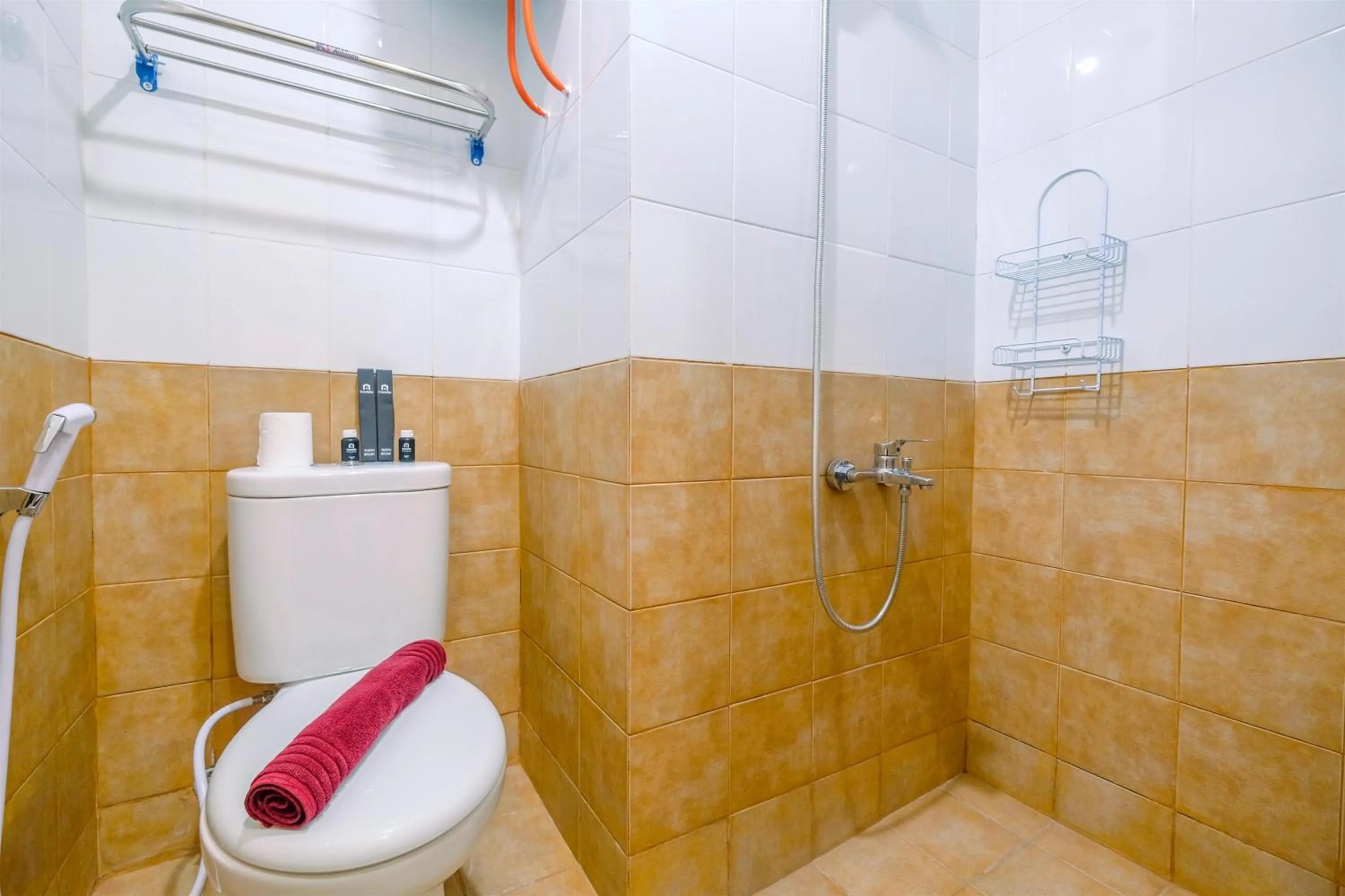 Bathroom in New Room Studio at Green Pramuka City Apartment By Travelio