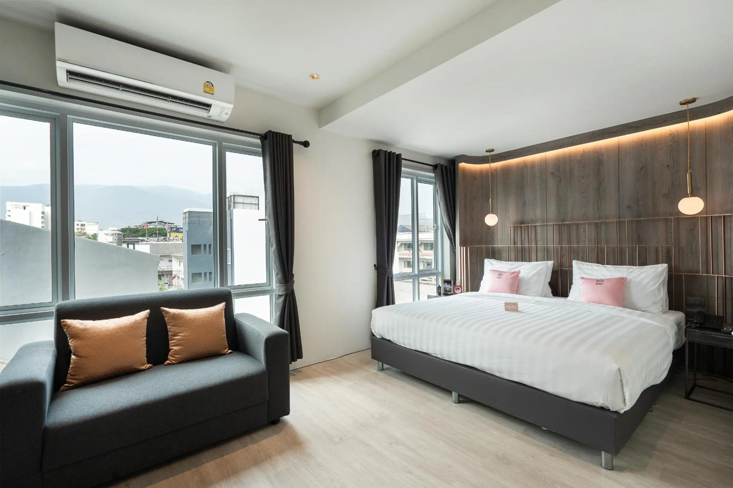 Bed in NIMANO SUITES