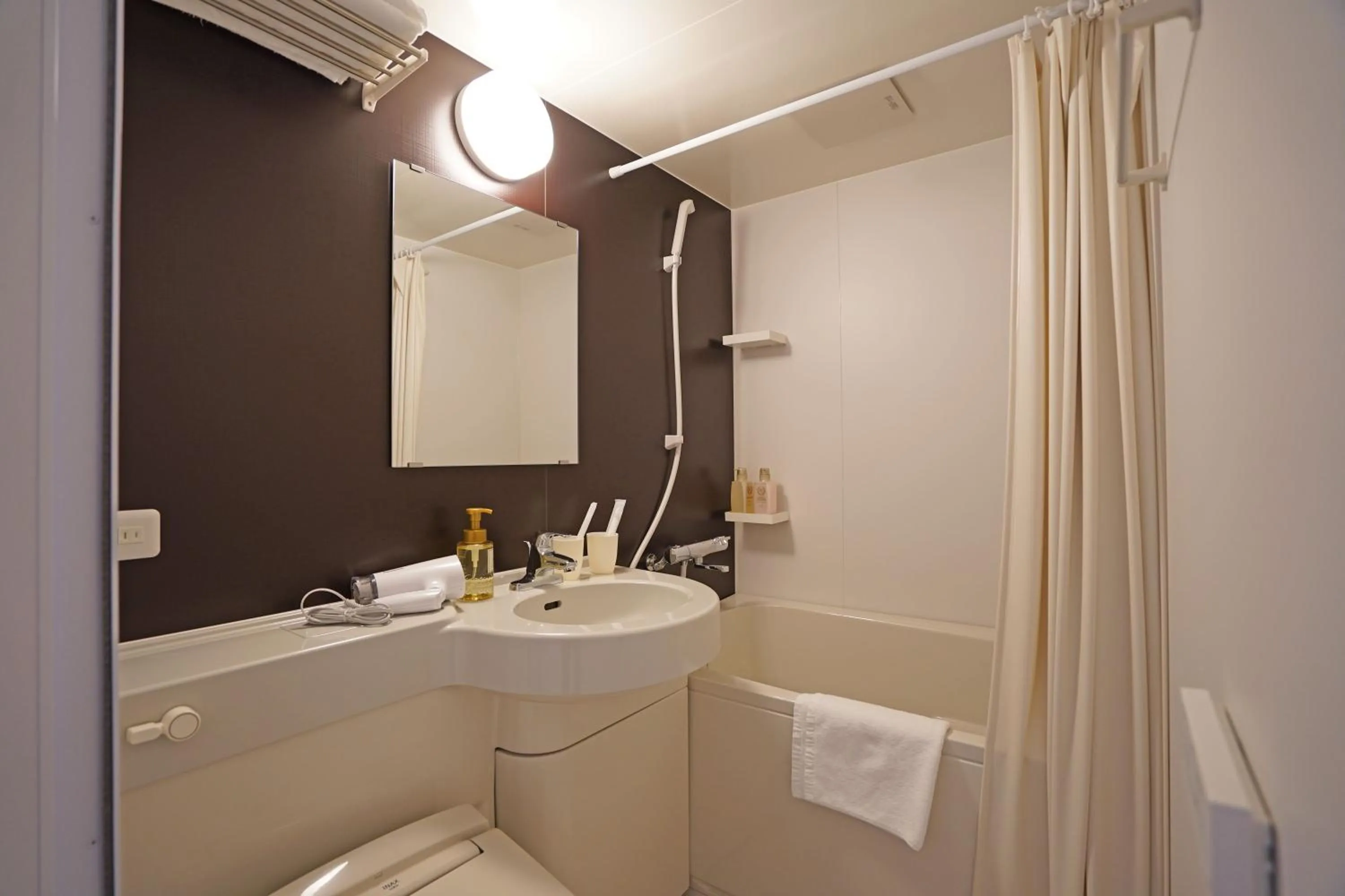 Bathroom in Plaza In Kanku Hotel