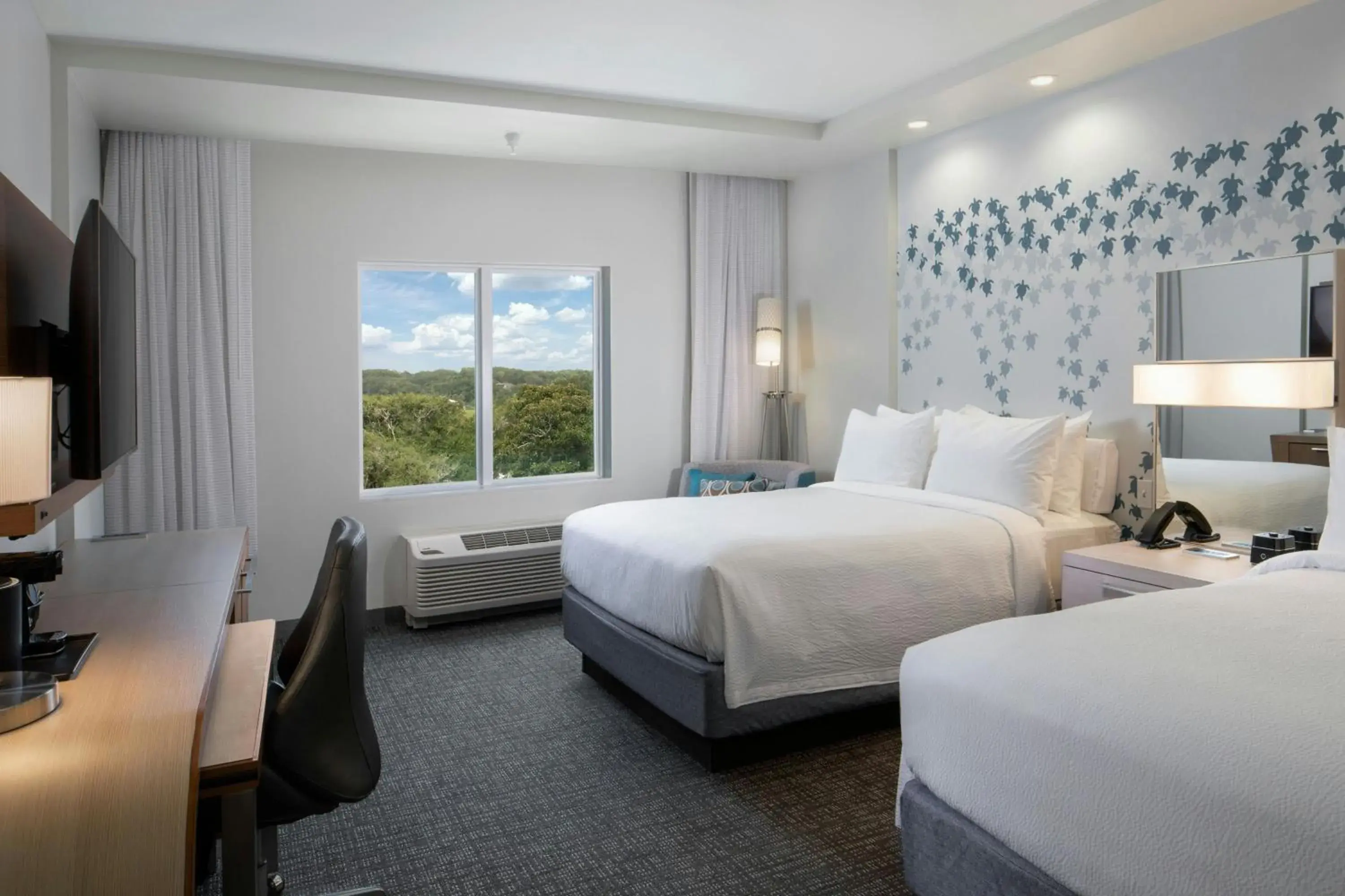 Queen Guest Room with Two Queen Beds and Sofa Bed in Courtyard Amelia Island Queen Guest Room with Two Queen Beds and Sofa Bed in Courtyard Amelia Island