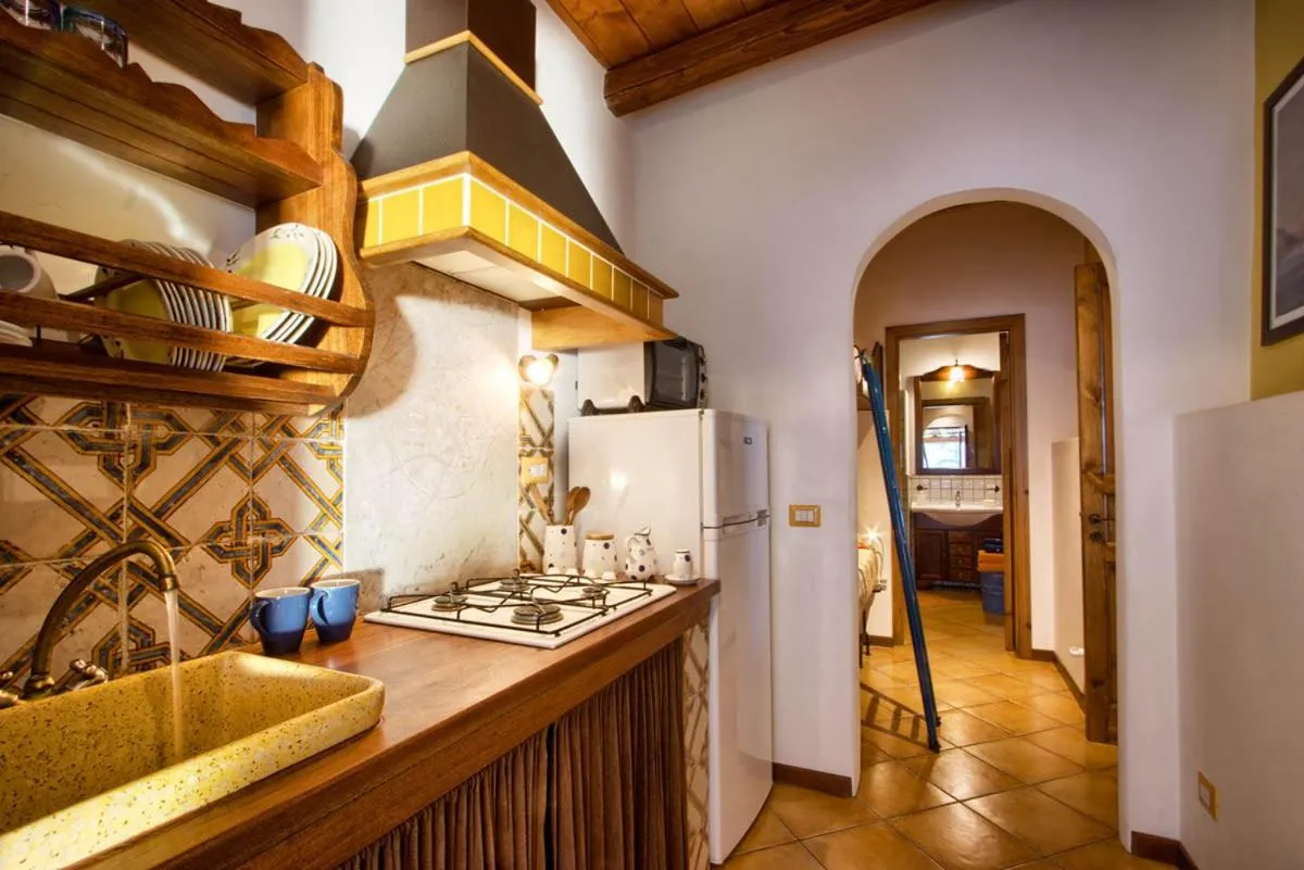 Kitchen or kitchenette in Case sulla spiaggia di Santa Marina Salina