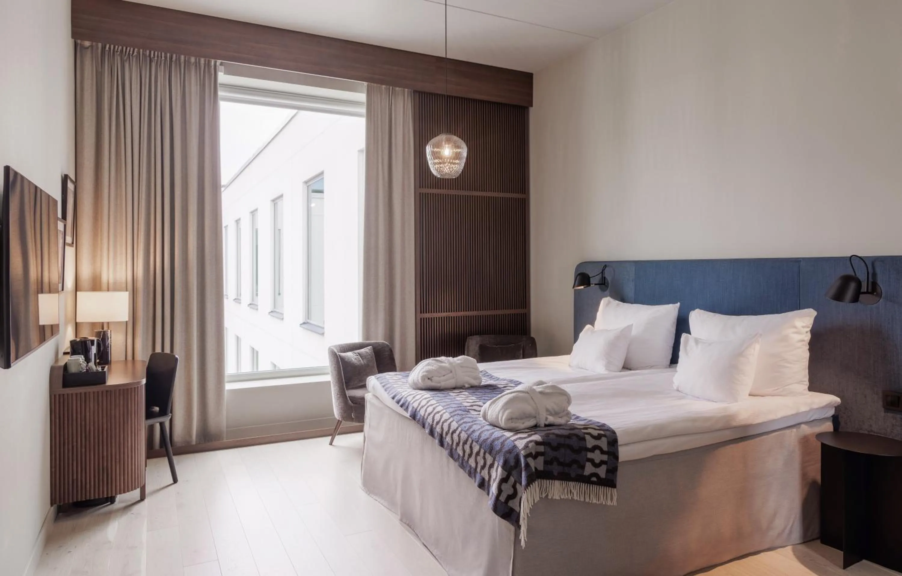 Bed in Clarion Collection Hotel Tapetfabriken