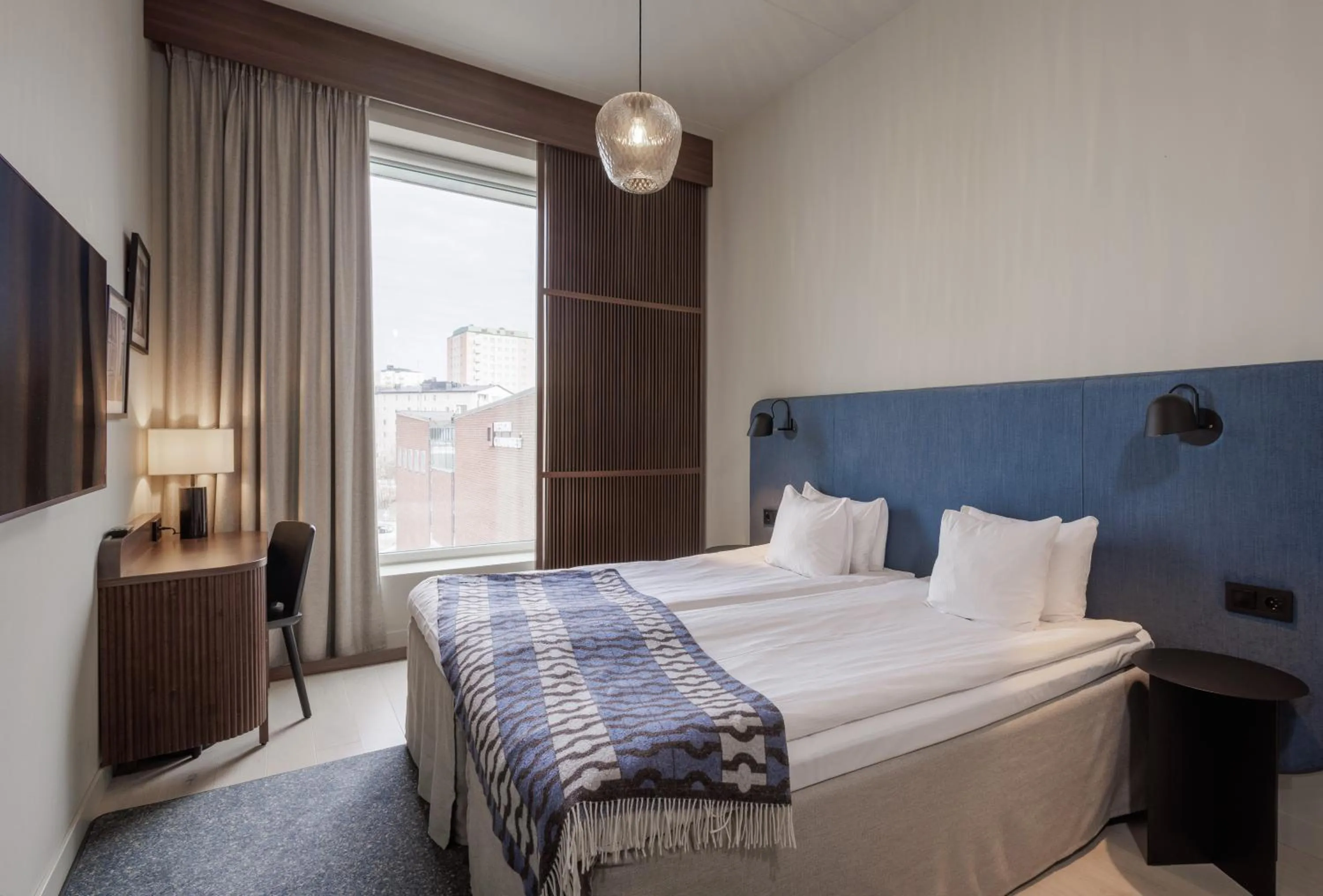 Bed in Clarion Collection Hotel Tapetfabriken