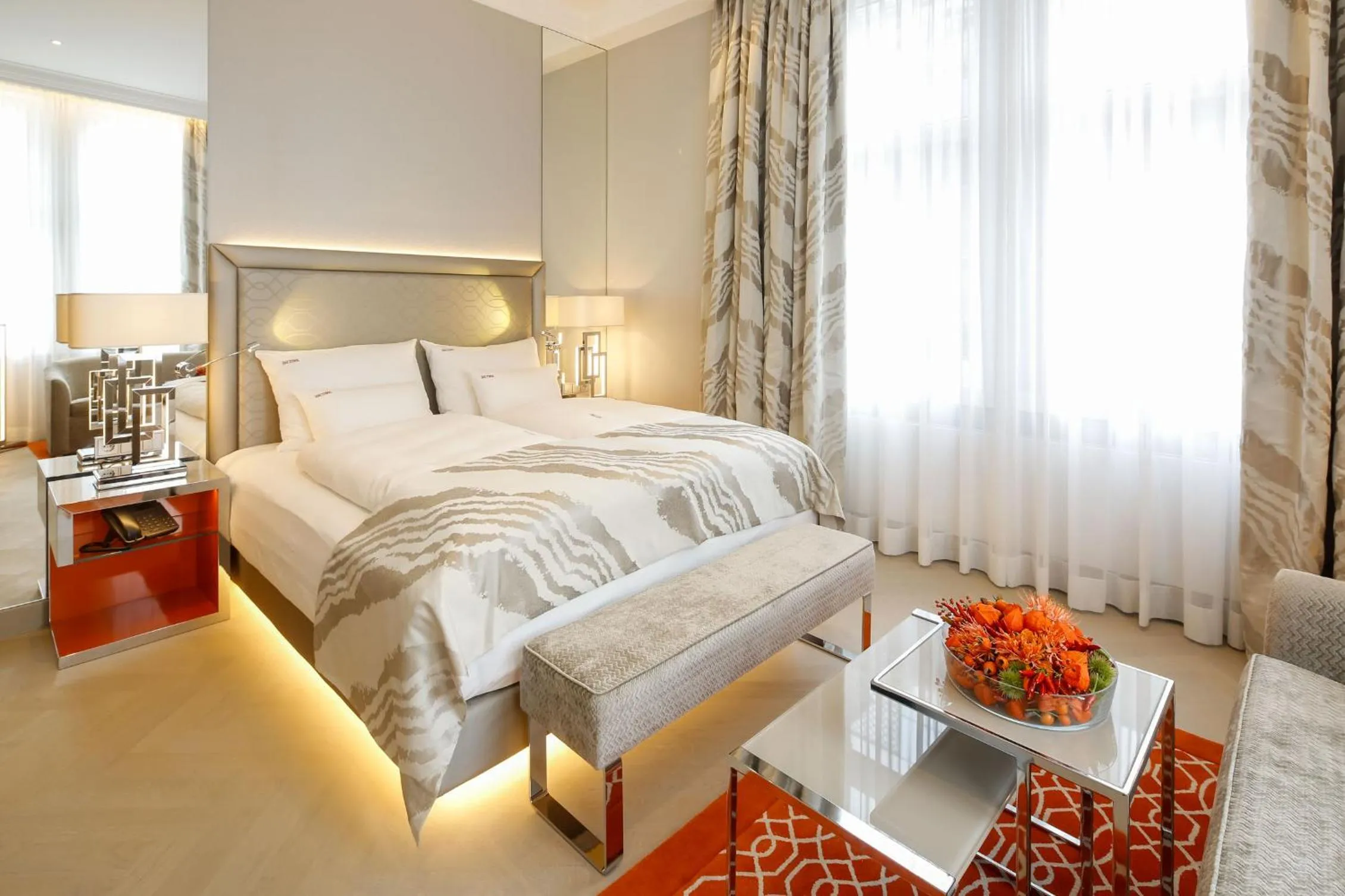 Seating area, Bed in Boutiquehotel Das Tyrol