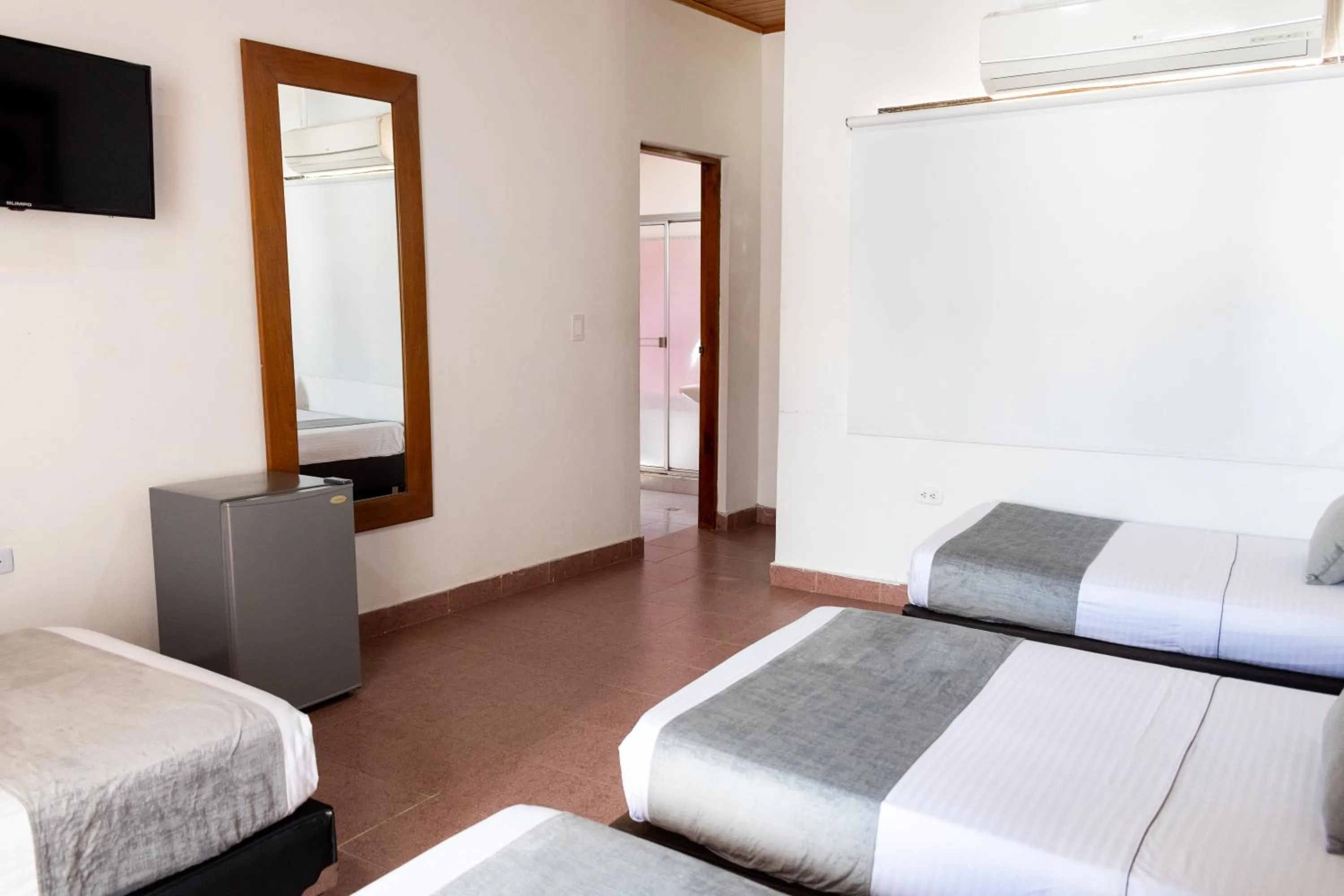 Photo of the whole room, Bed in Hotel Corozal Plaza