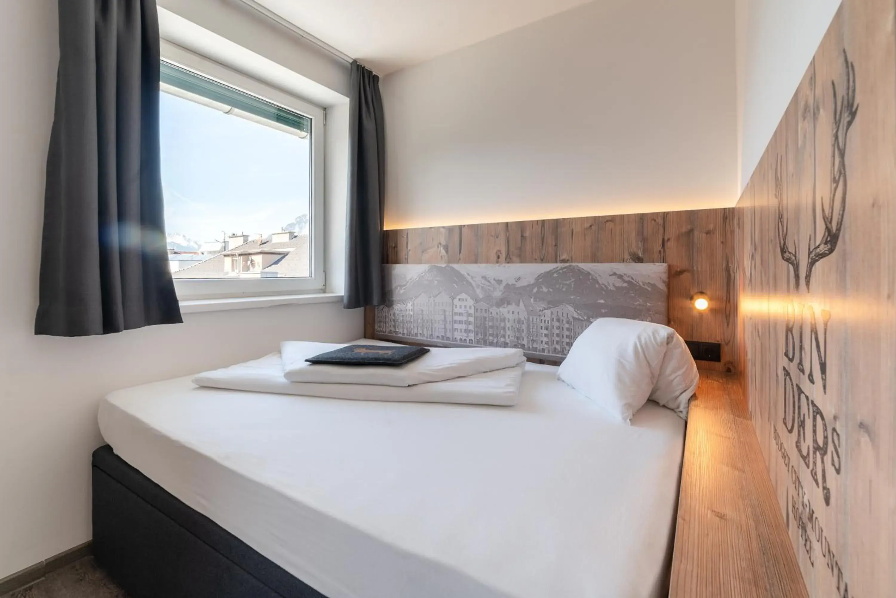 Bed in BinderS Budget City-Mountain Hotel Bed in BinderS Budget City-Mountain Hotel