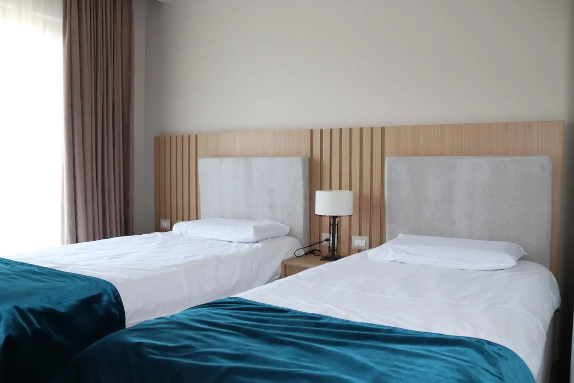 Bed in Perla Hotel Bed in Perla Hotel