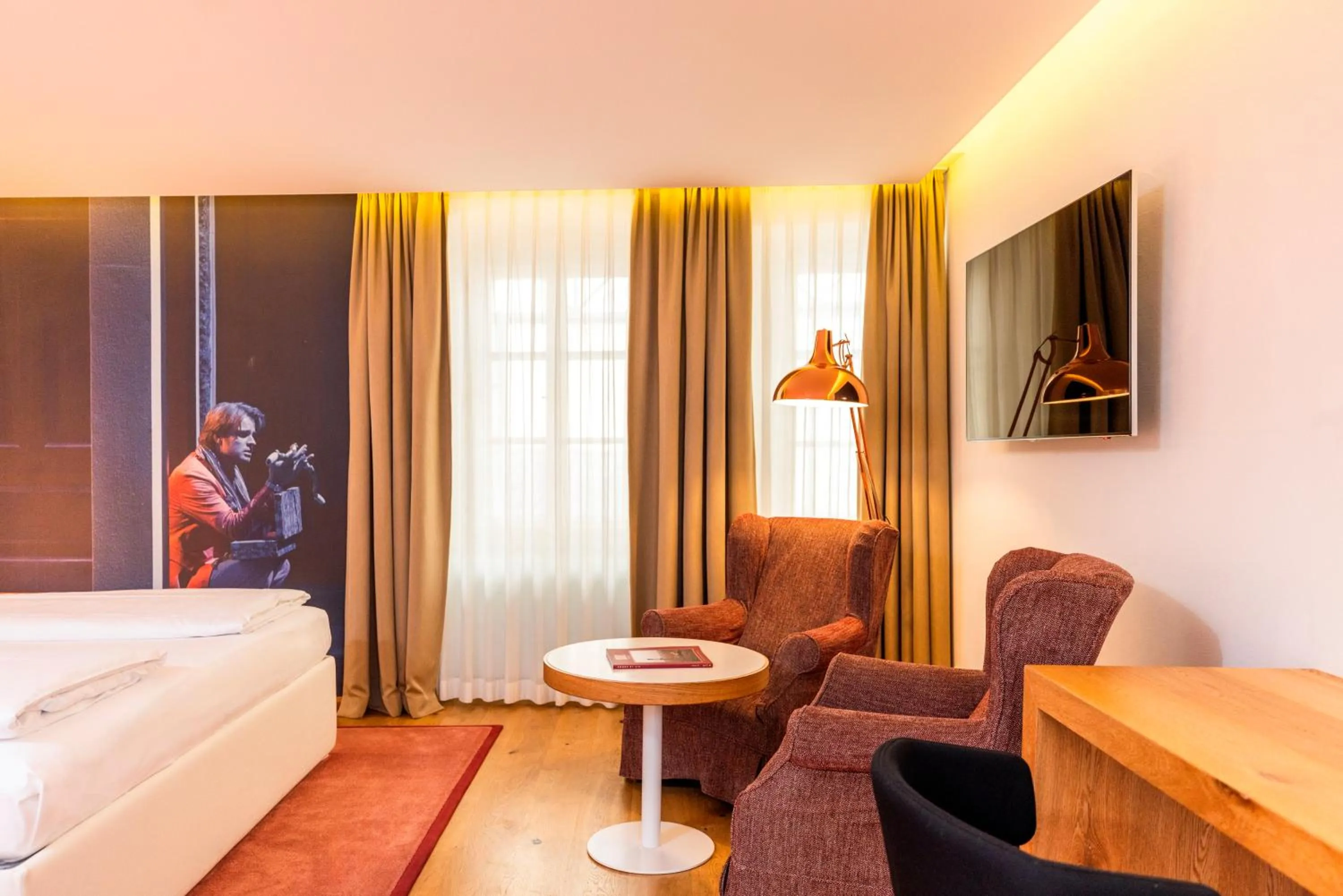 Seating area, Bed in Small Luxury Hotel Goldgasse