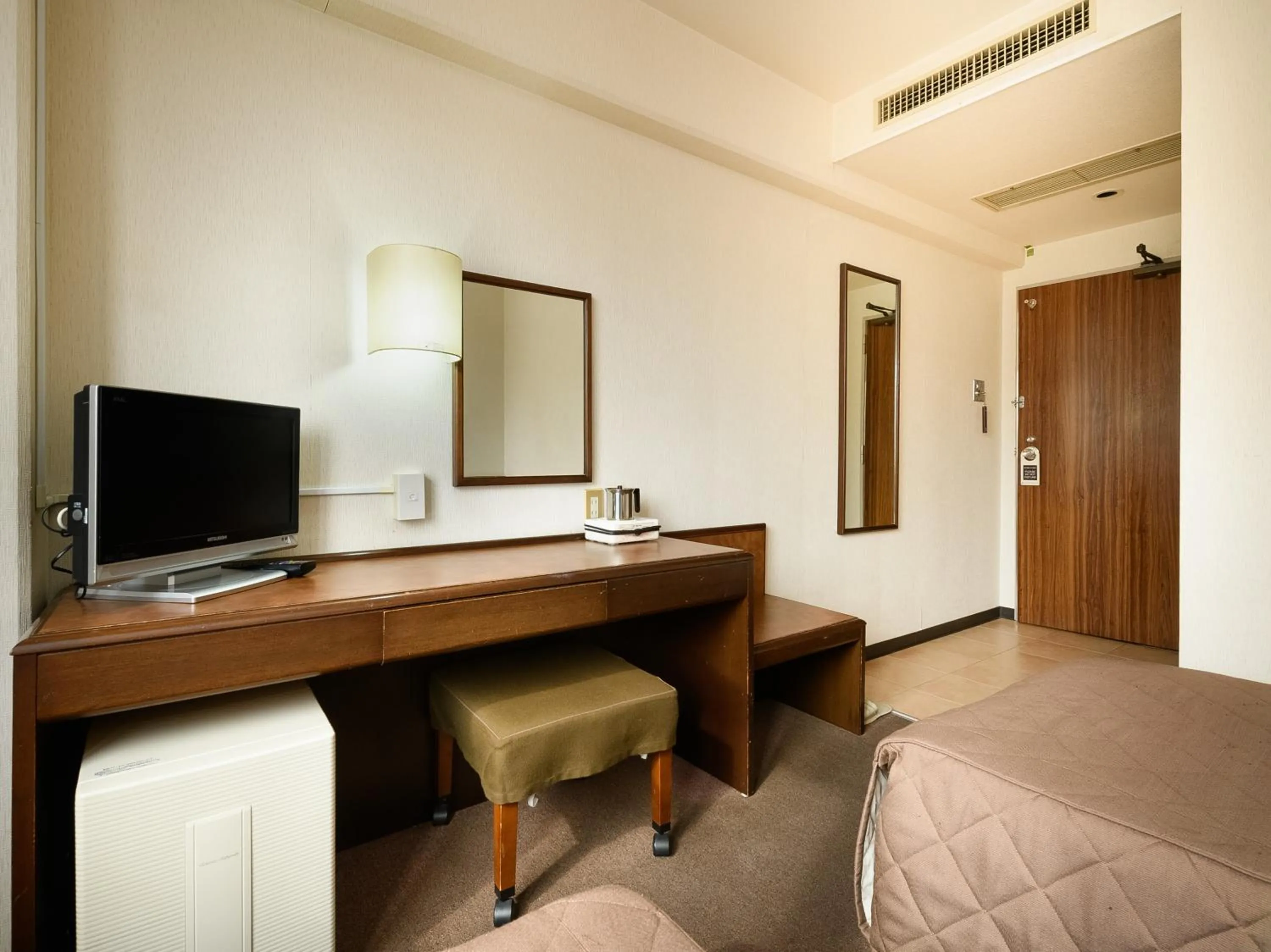 Bed in Tabist Kameyama Daiichi Hotel