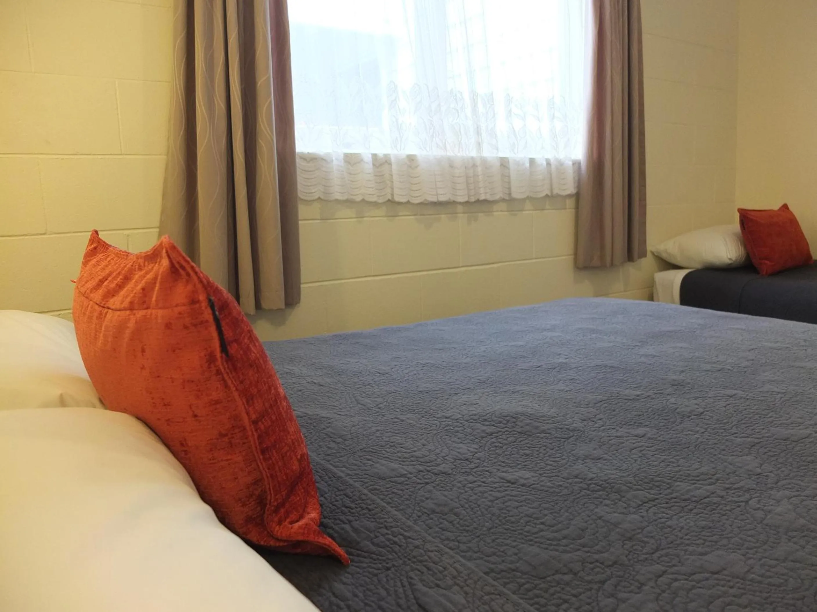 Bed in Colonial Court Motel