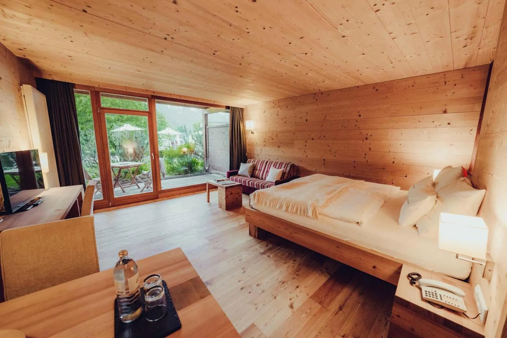 Bed in Holzhotel Forsthofalm